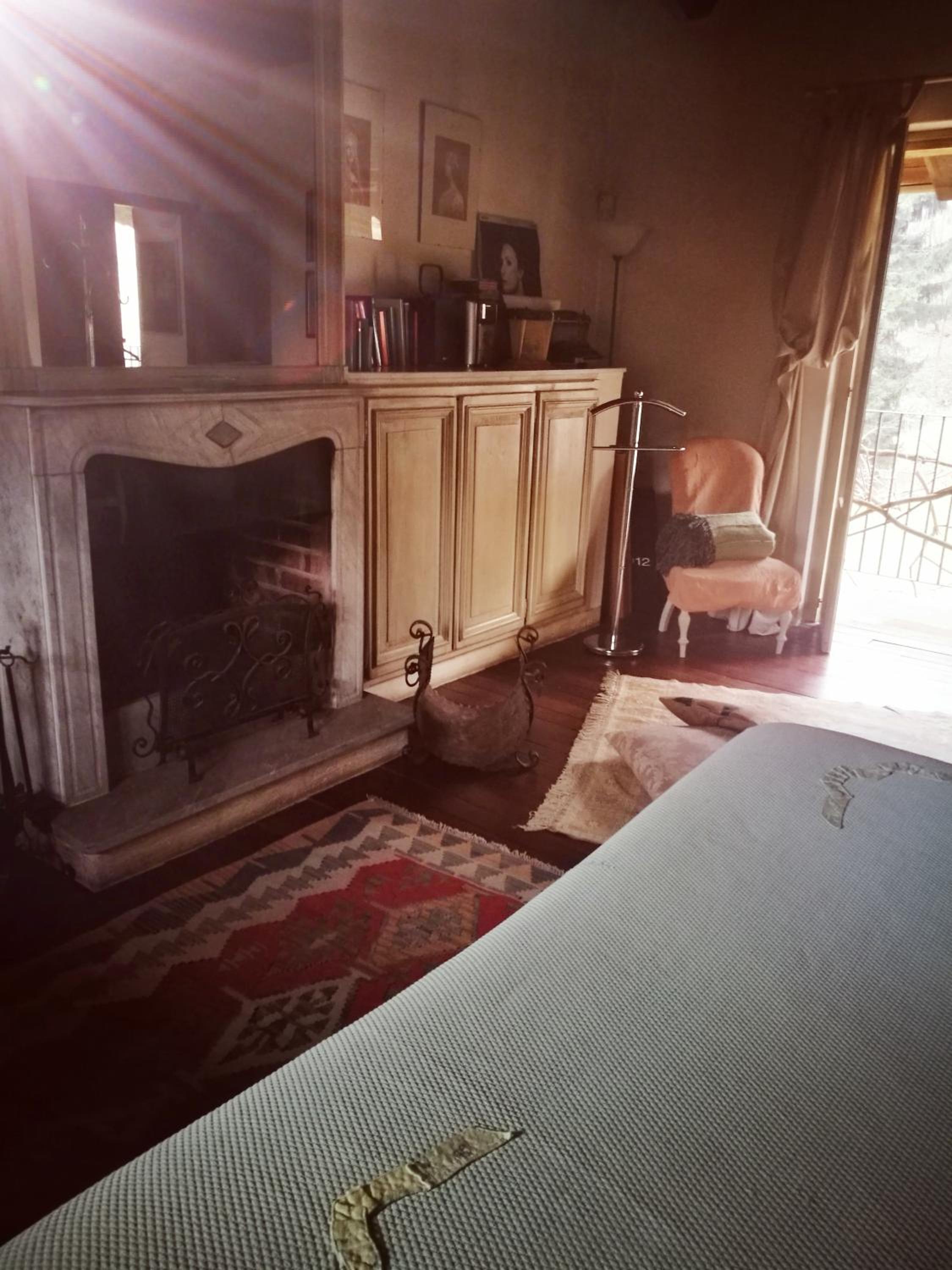 Romantic double bedroom with fireplace and small balcony photo 2