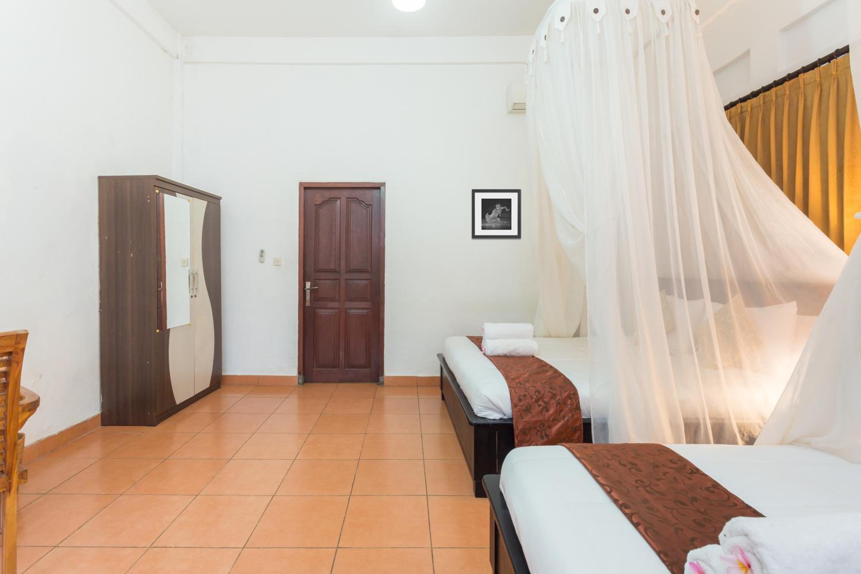 Deluxe Quadruple Room - Photo 8
