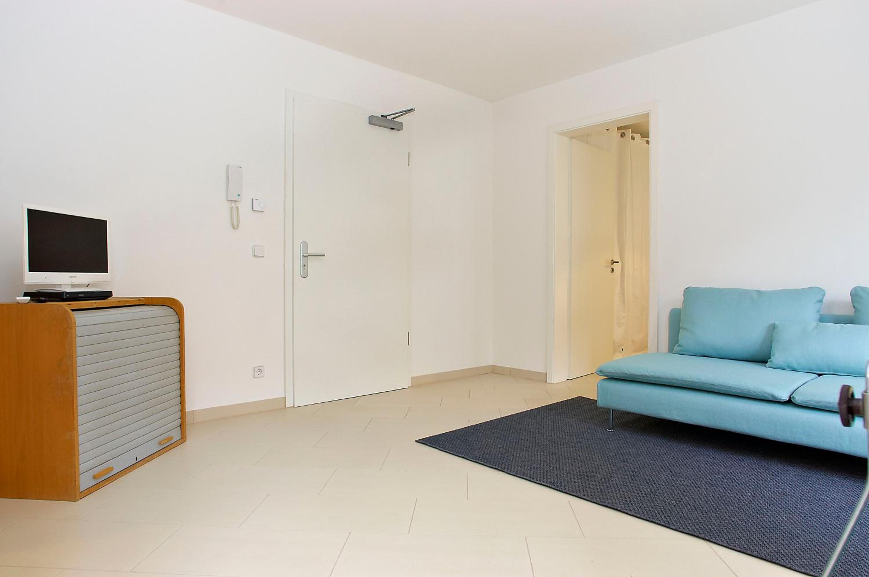One-Bedroom Apartment with living room, kitchenette and balcony photo 1