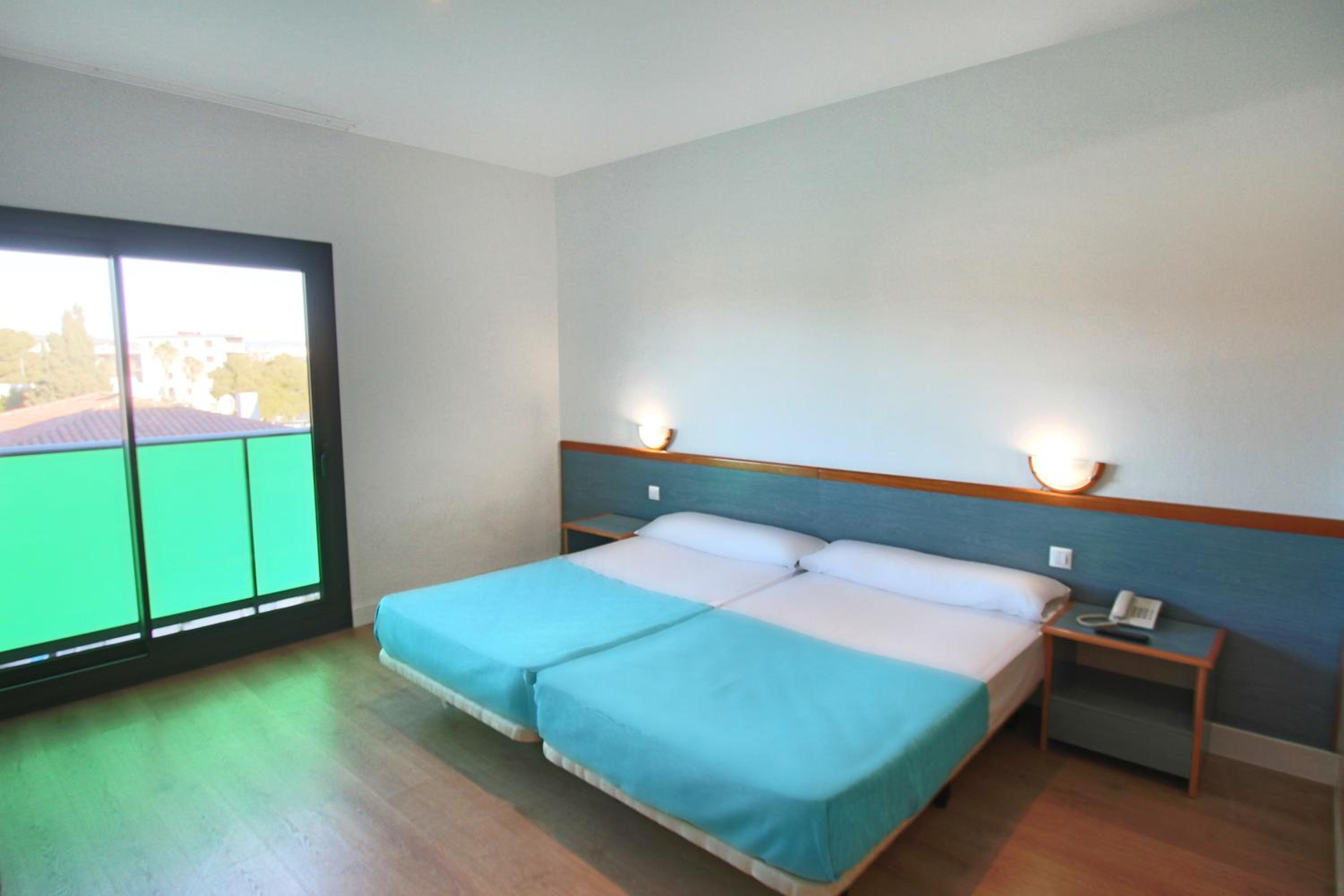 Habitación Doble con Dos Camas Dobles