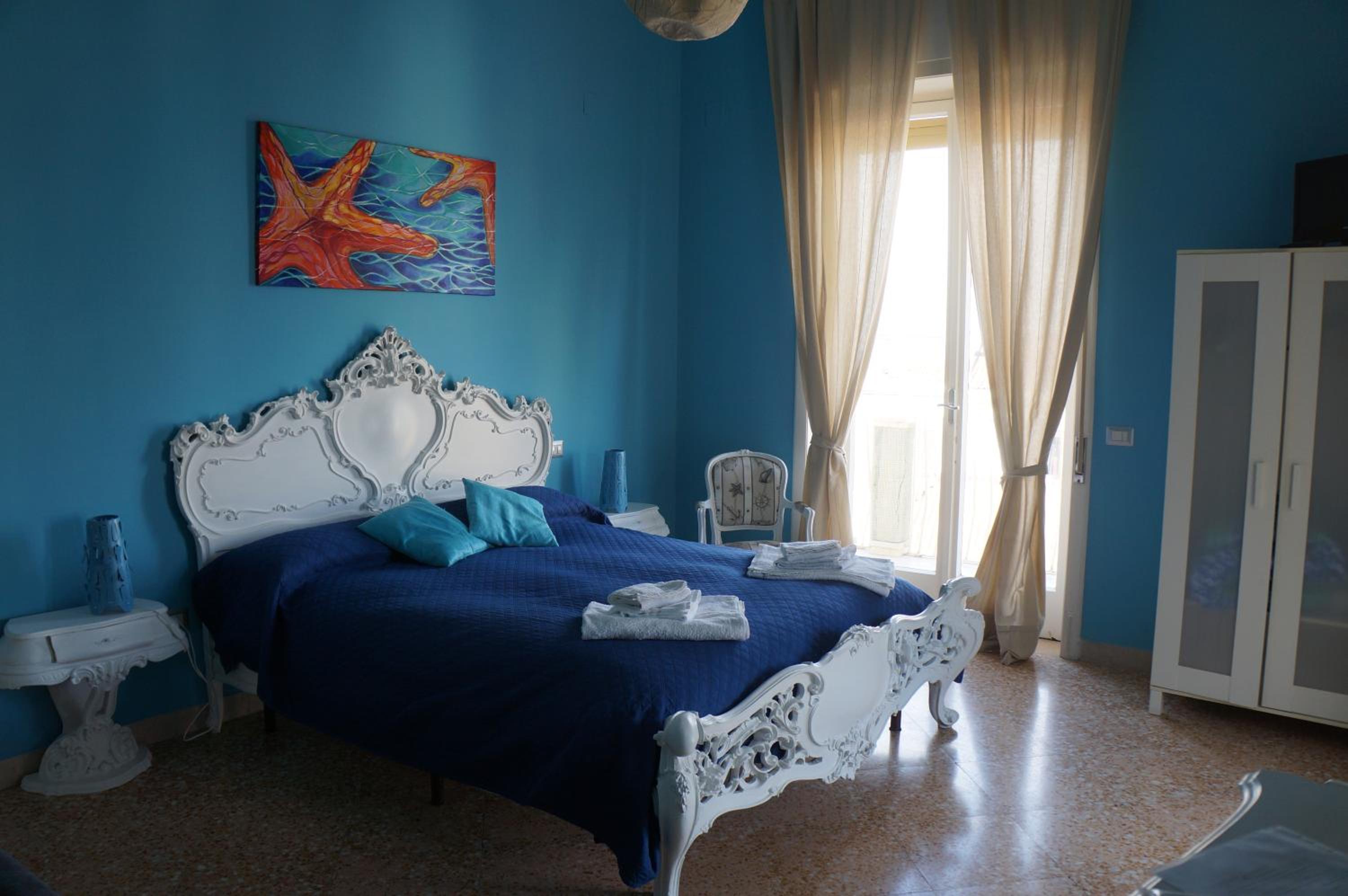 Quadruple Room with Balcony and Sea View and Private External Bathroom