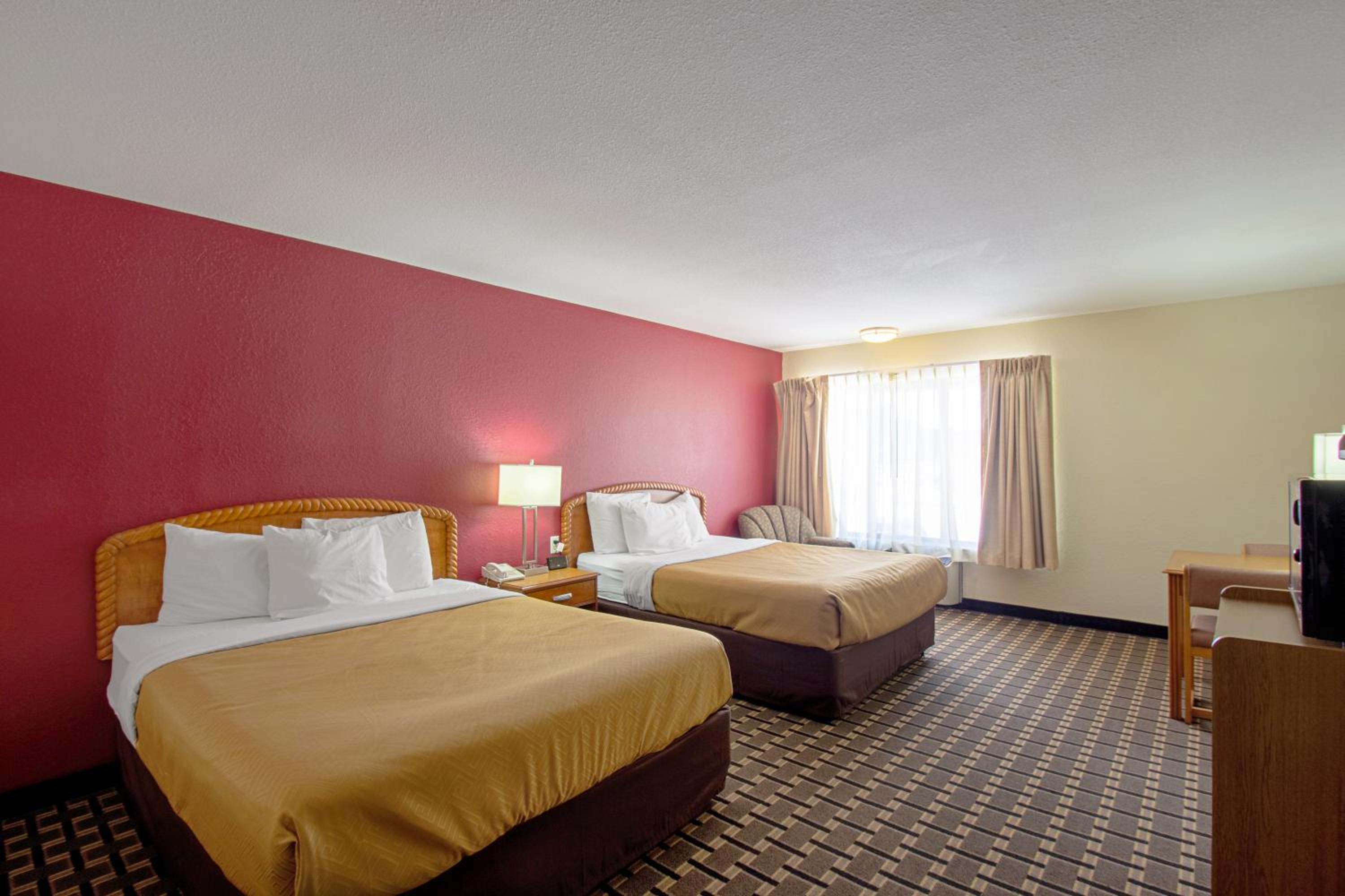 Queen Suite with Two Queen Beds and Sofa Bed - Non-Smoking photo 1