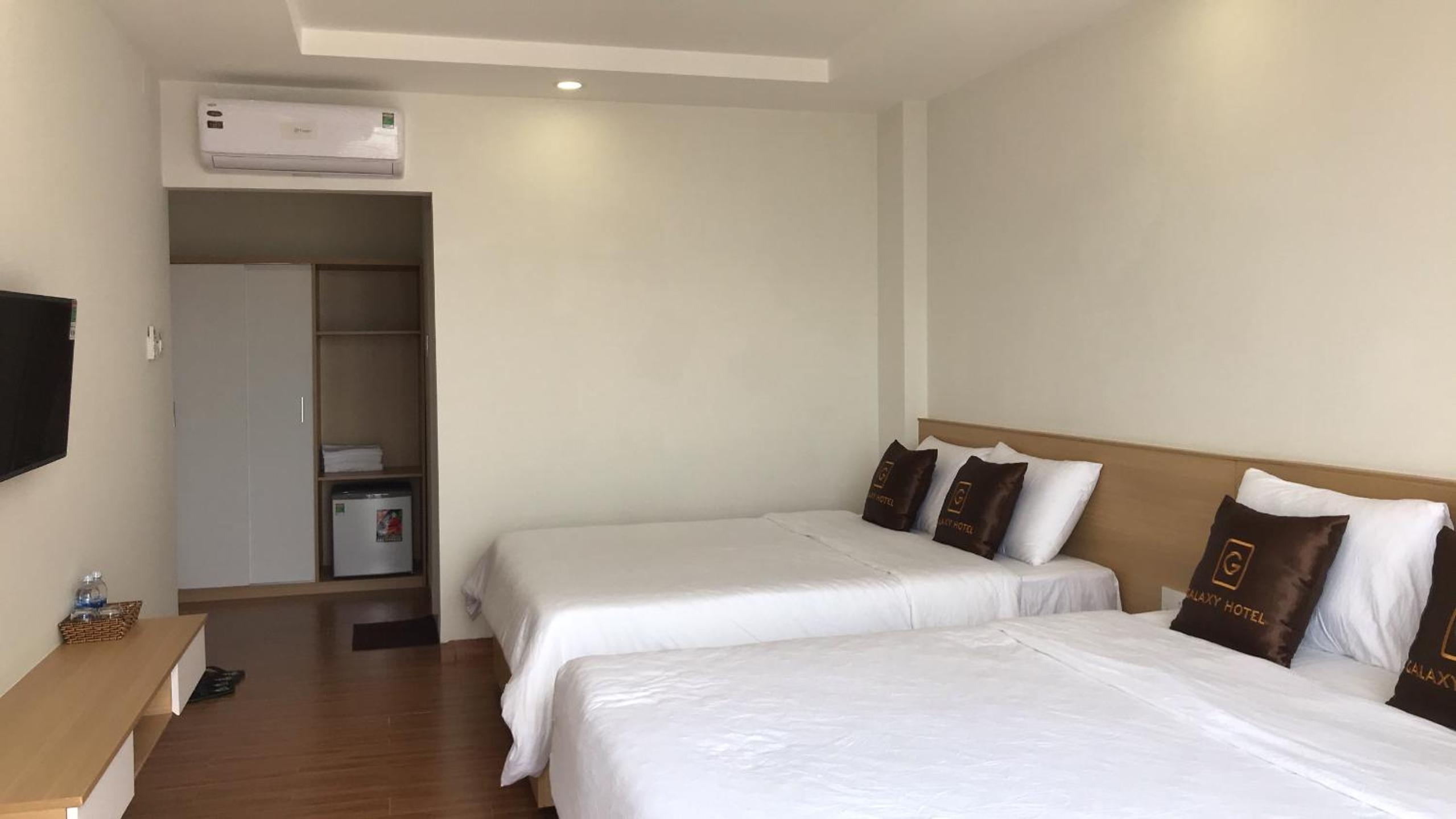 Deluxe Queen Room with Two Queen Beds - Photo 1