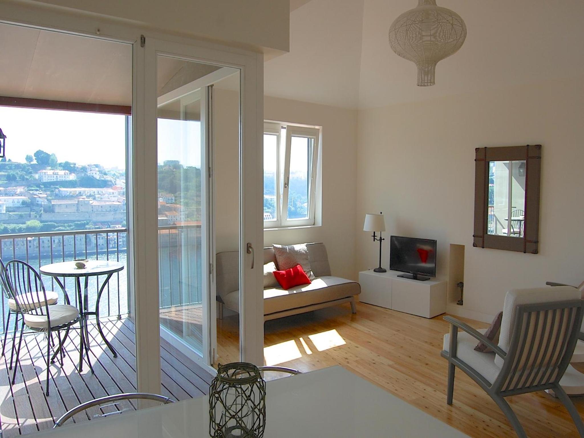 One-Bedroom Apartment with Balcony and River View