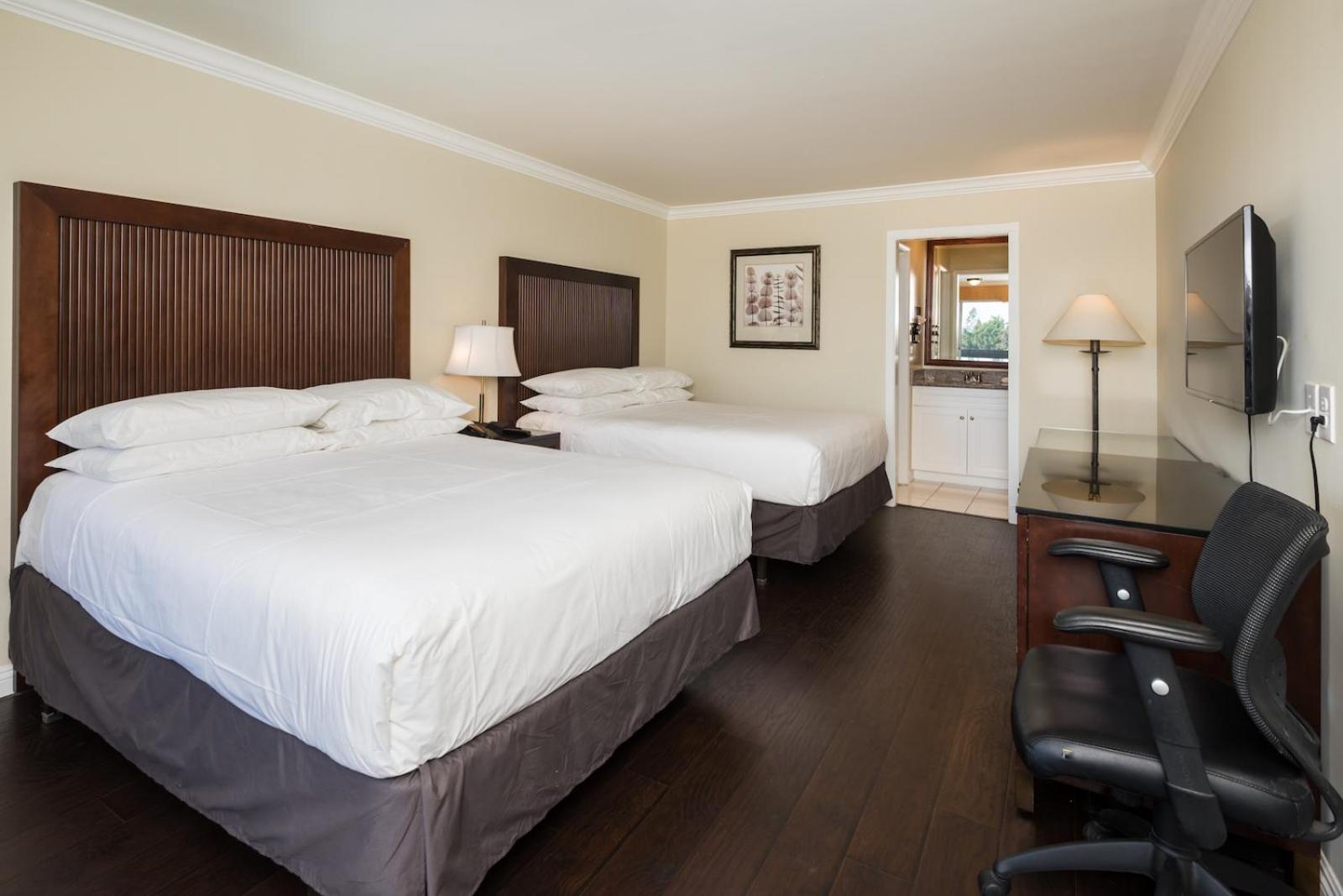 Deluxe Queen Room with Two Queen Beds - Photo 1