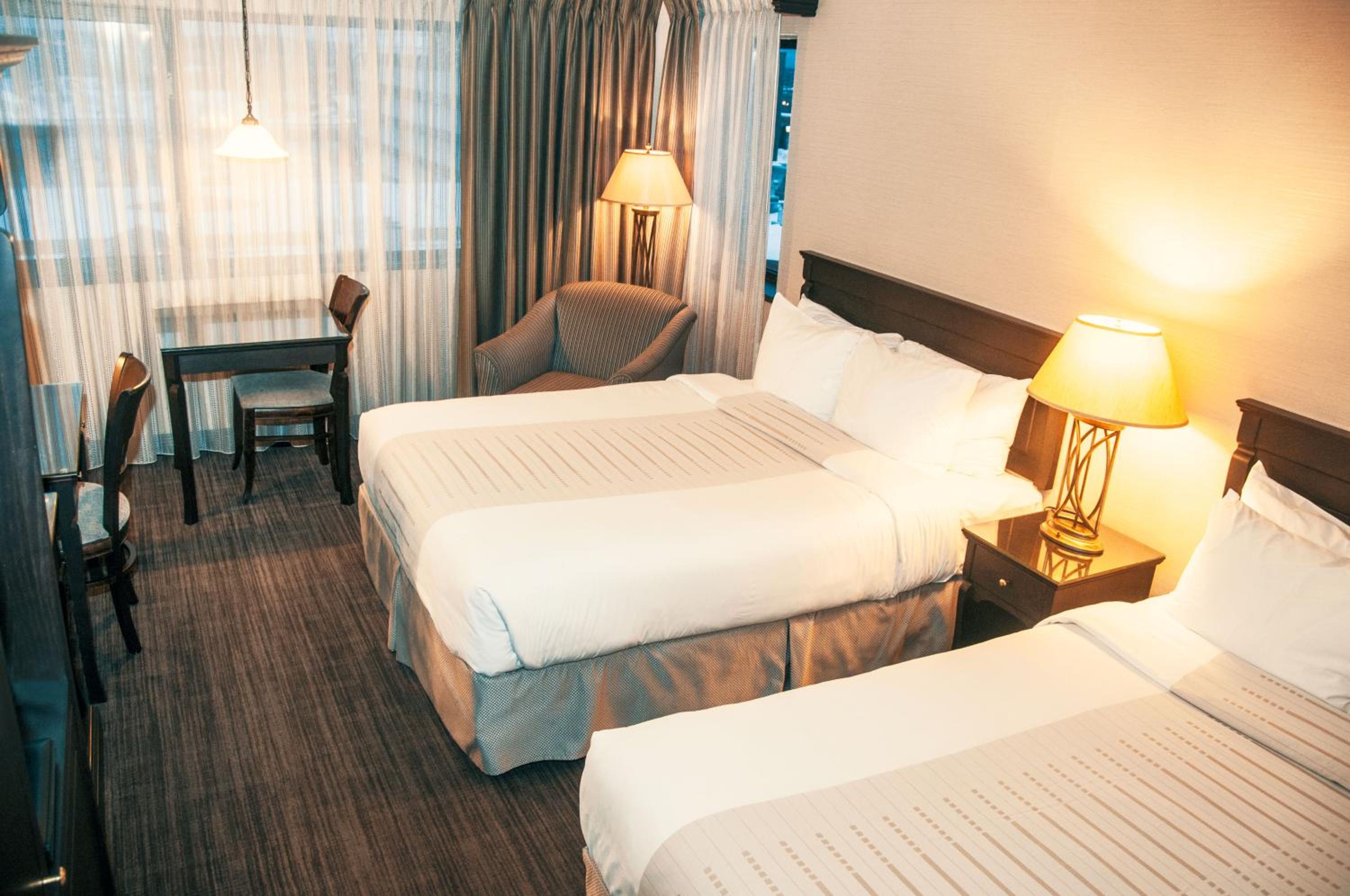 Economy Queen Room with Two Queen Beds  - Photo 1
