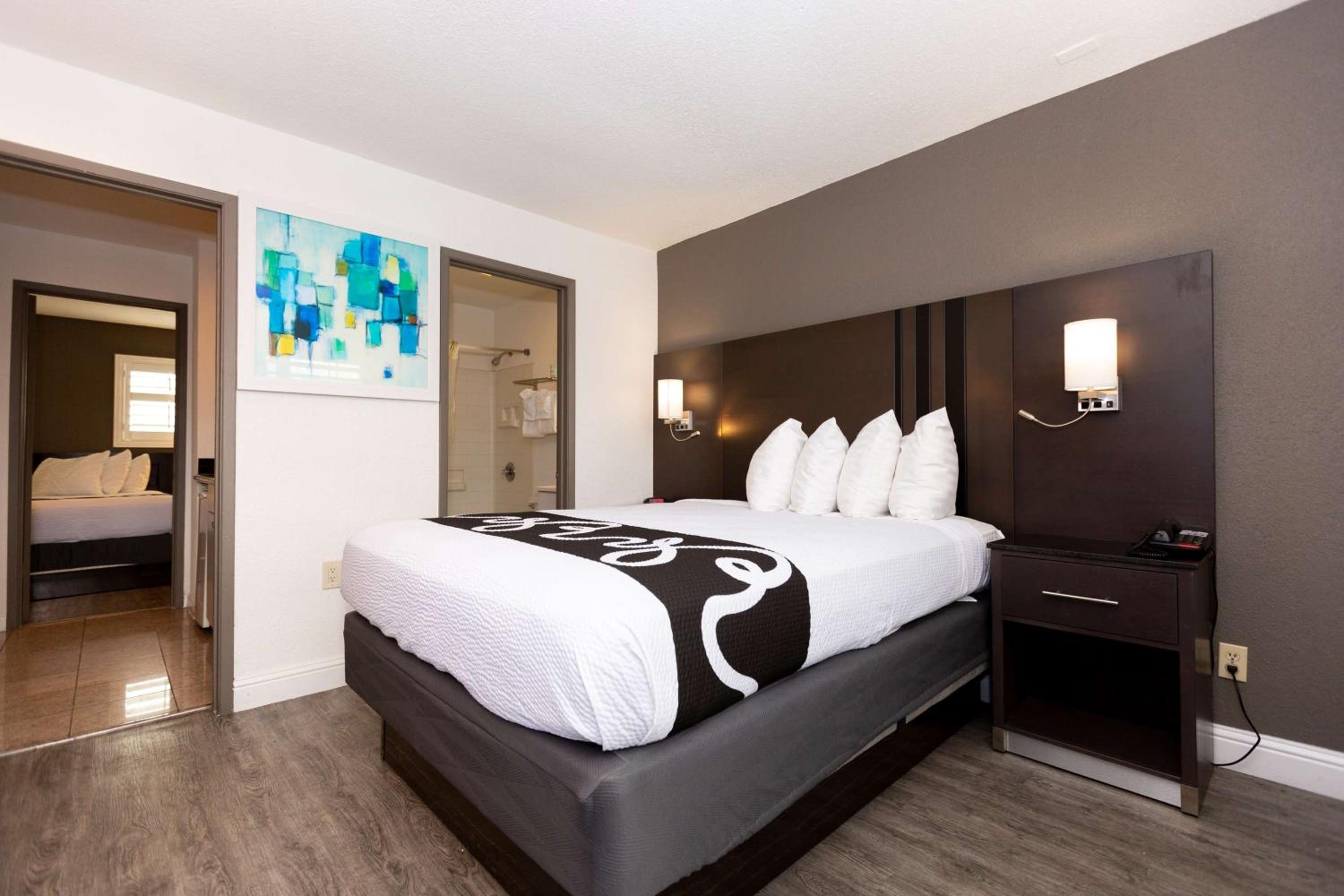Suite with One Queen and Two Double Beds - Non-Smoking photo 1