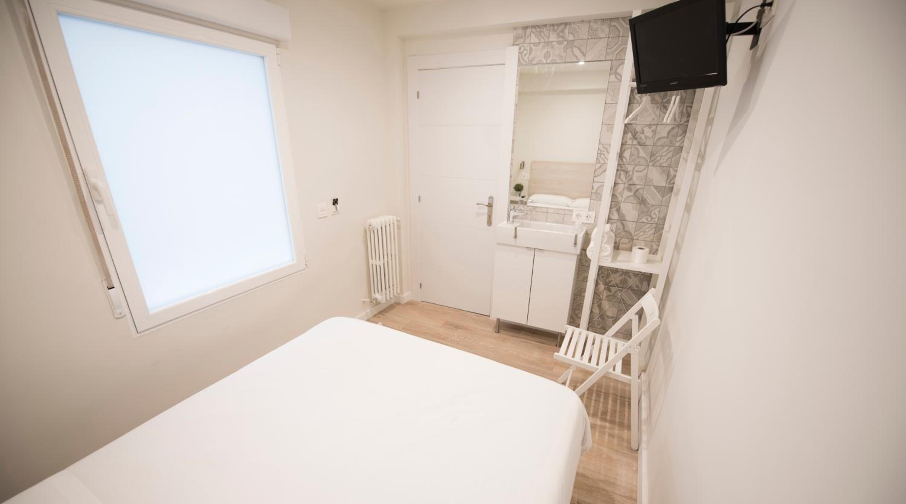 Habitación individual con baño compartido