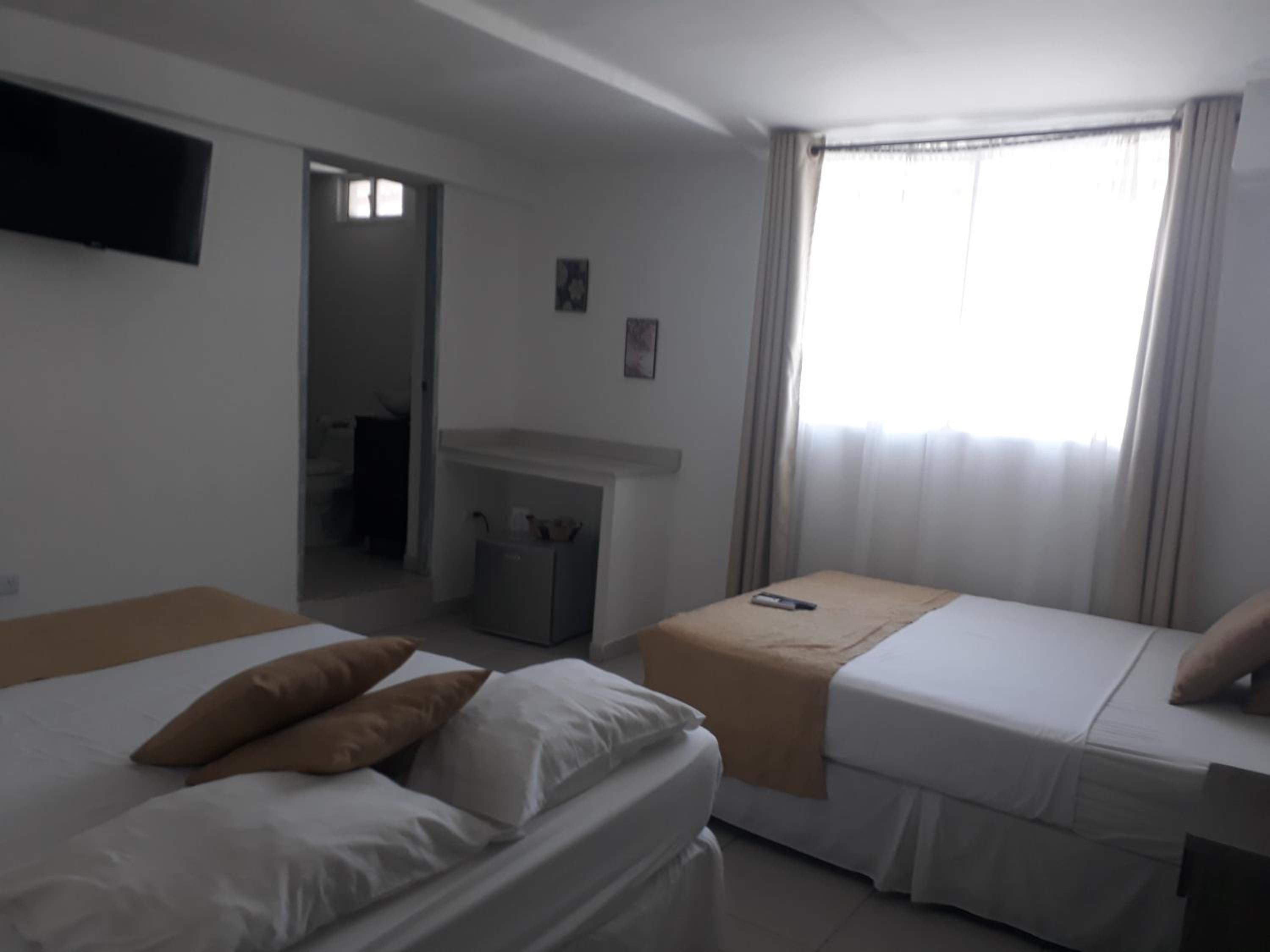 Deluxe Queen Room with Two Queen Beds photo 1