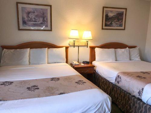 Queen Room with Two Queen Beds - Photo 1