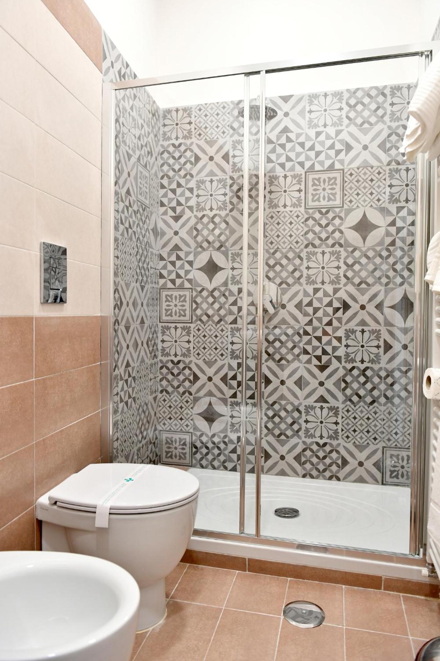 Deluxe Quadruple Room - Photo 10
