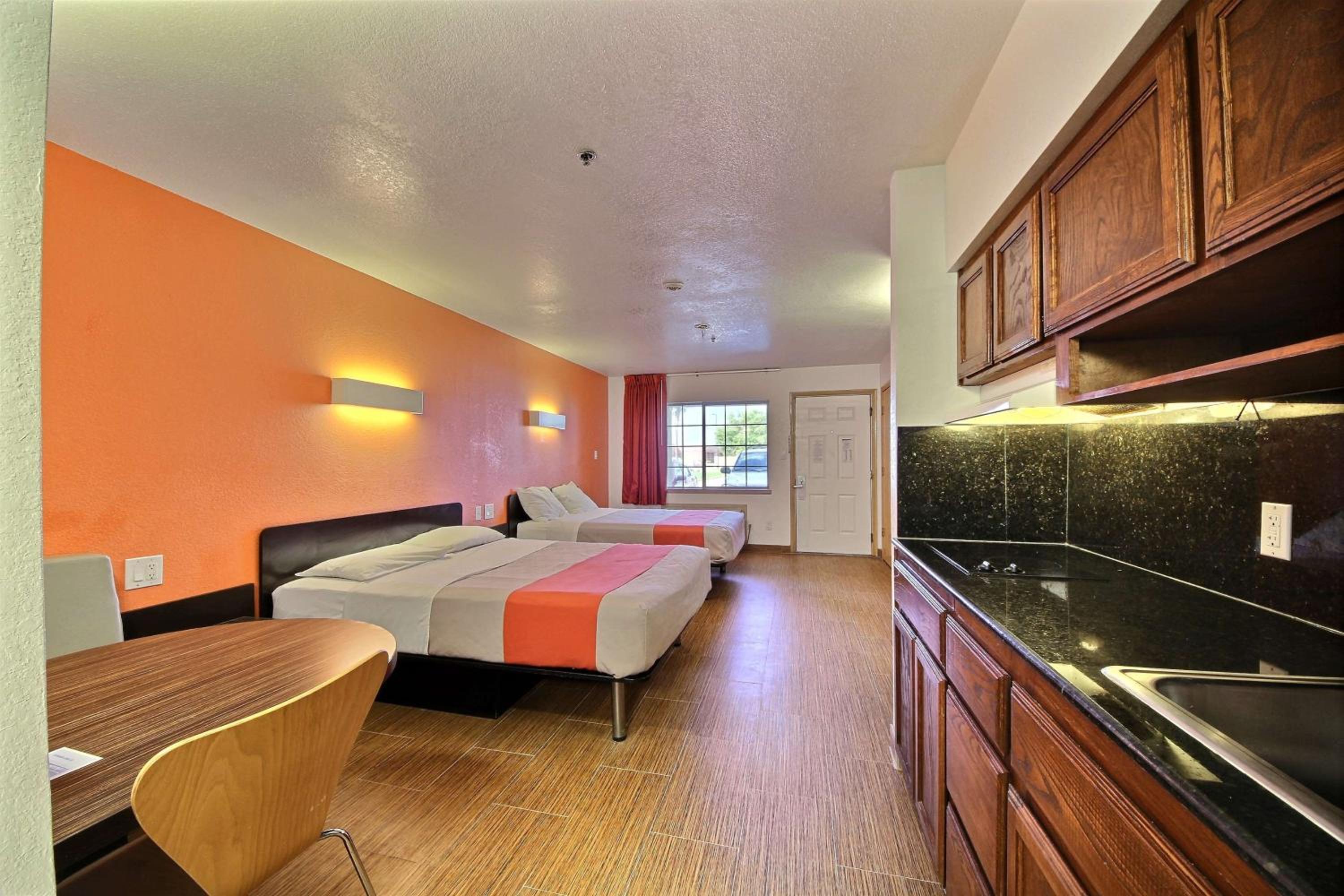 Deluxe Queen Room with Two Queen Beds - Smoking - Photo 1