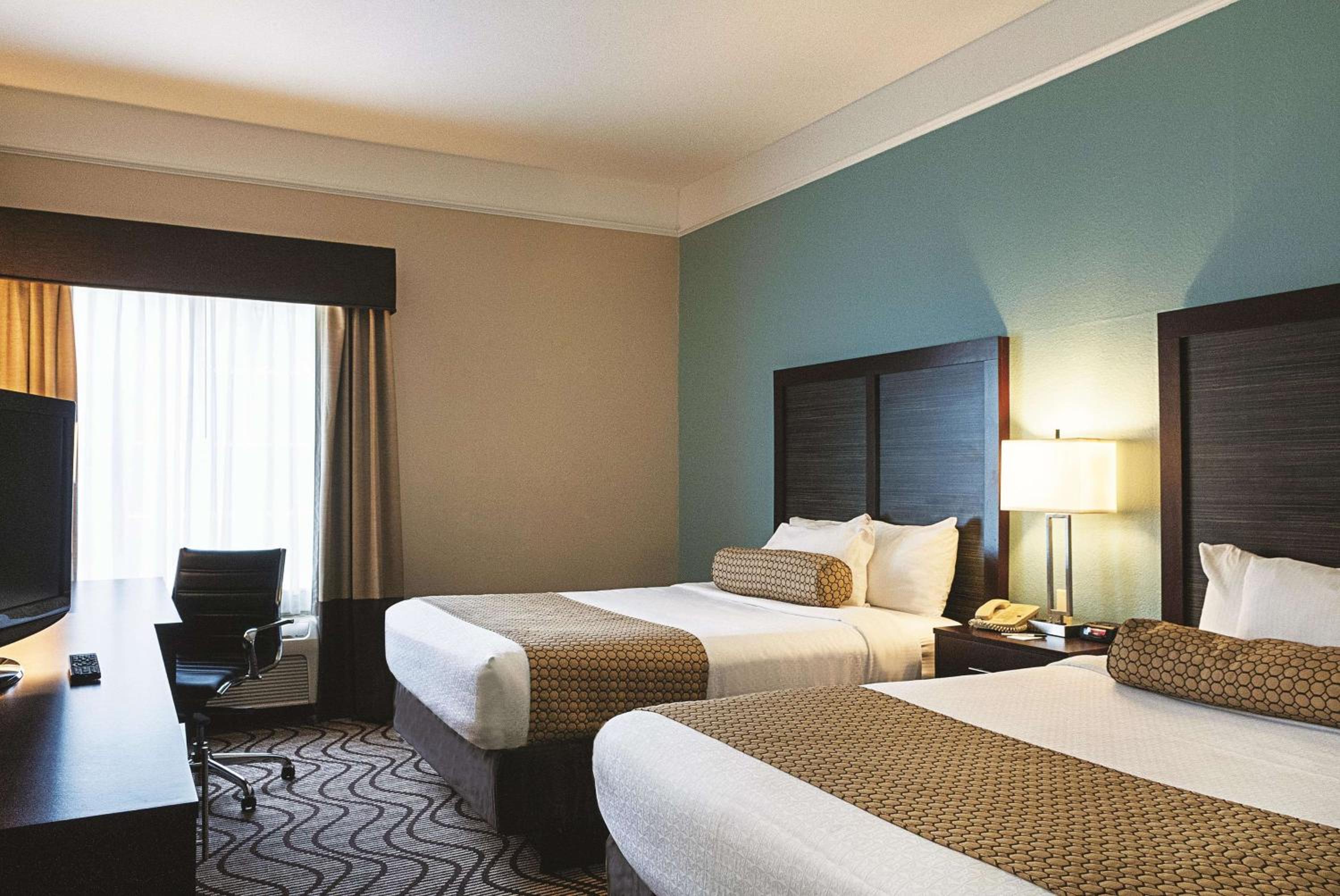 Deluxe Queen Room with Two Queen Beds - Photo 1