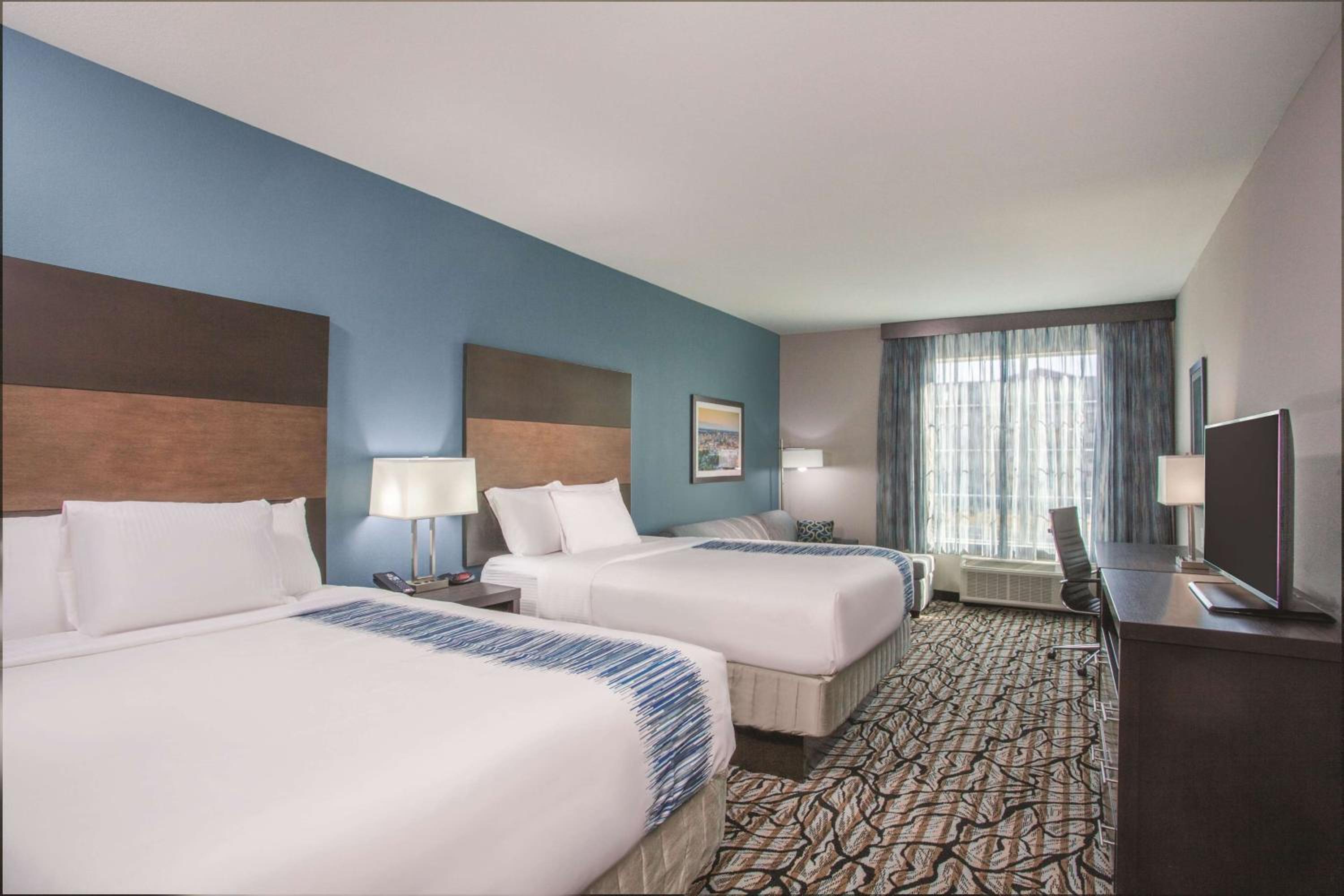 Deluxe Queen Room with Two Queen Beds - Non-Smoking photo 1