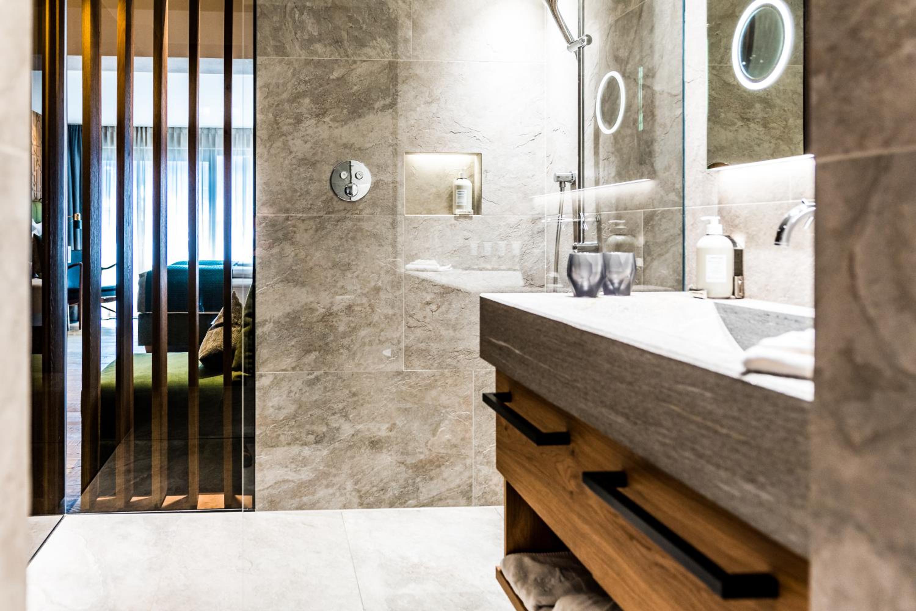 photo of a bathroom with a large mirror on the wall
