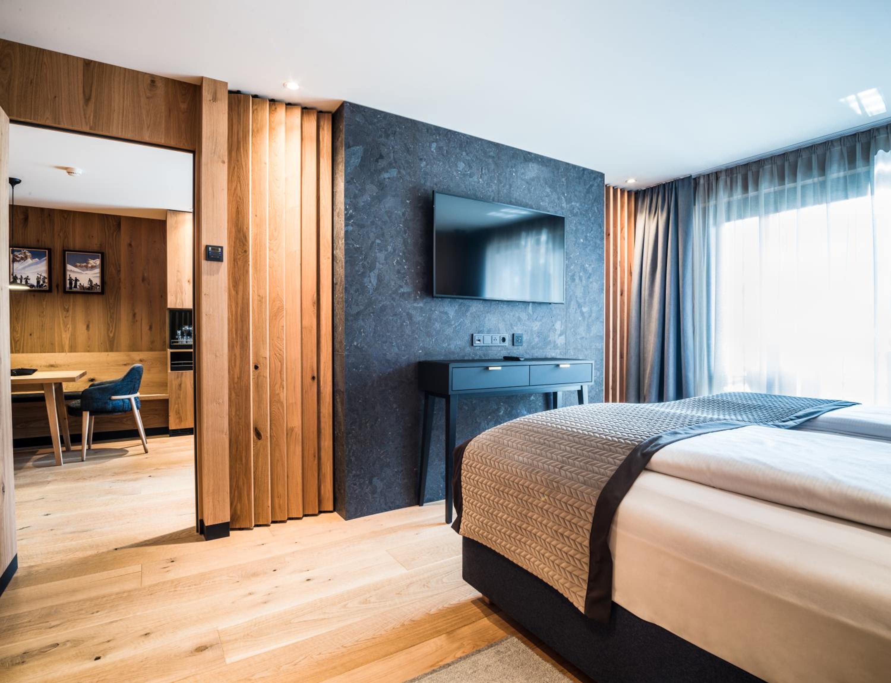 bedroom with a large bed and a flat screen tv