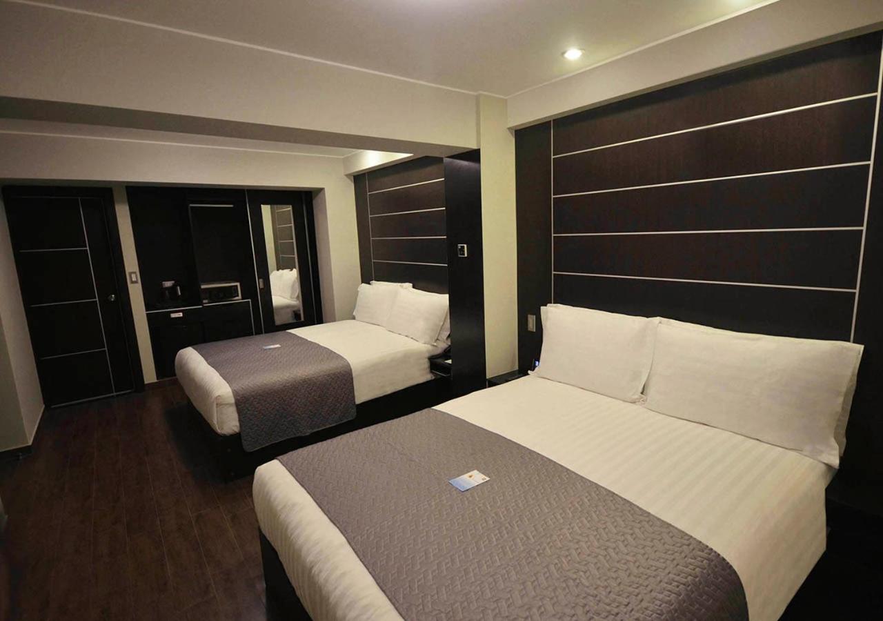 Standard Queen Room with Two Queen Beds photo 1