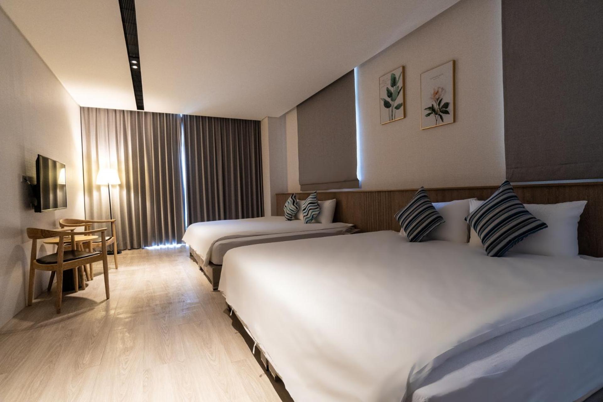 Deluxe Quadruple Room - Photo 12