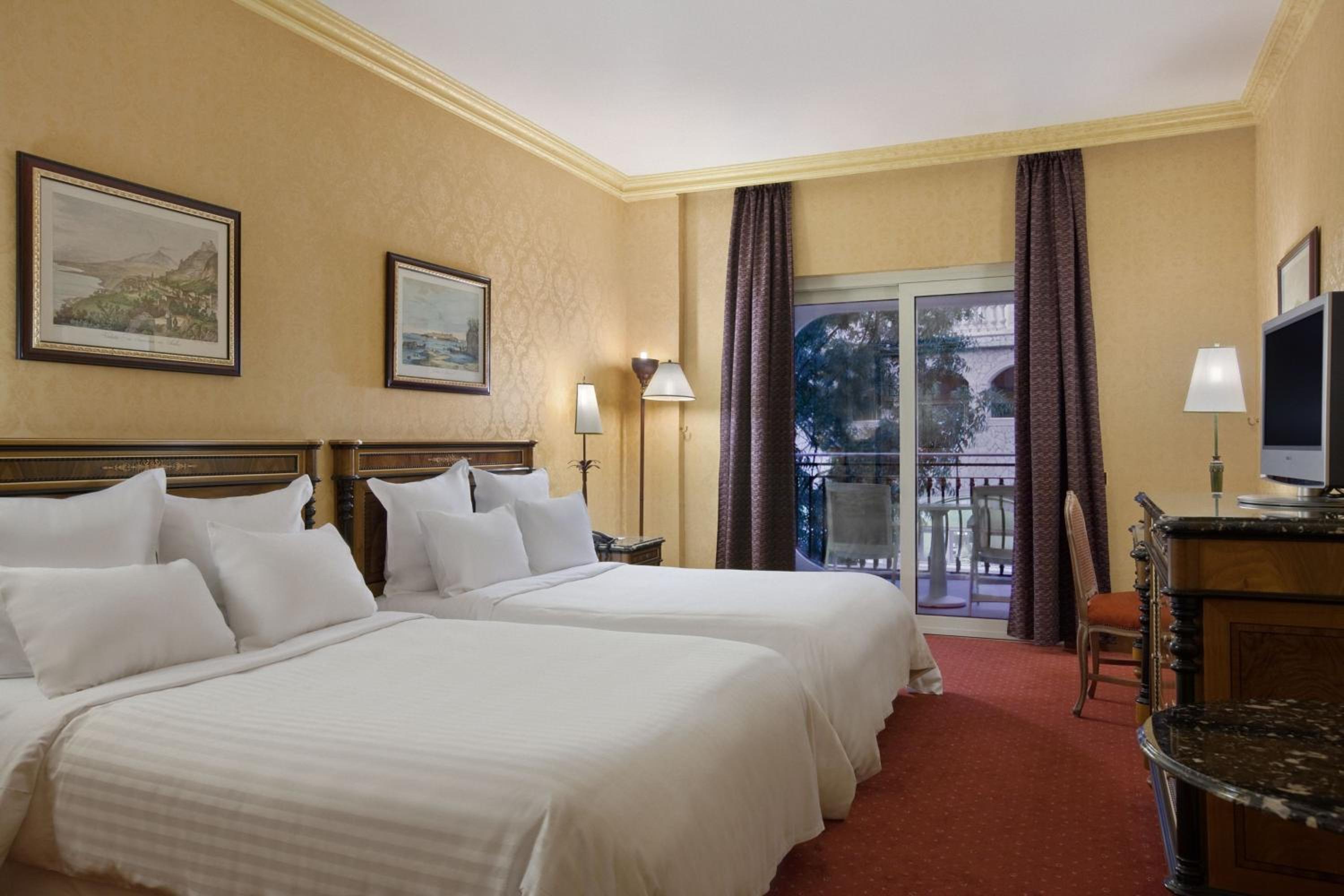 Queen Room with Two Queen Beds and Balcony - Photo 2