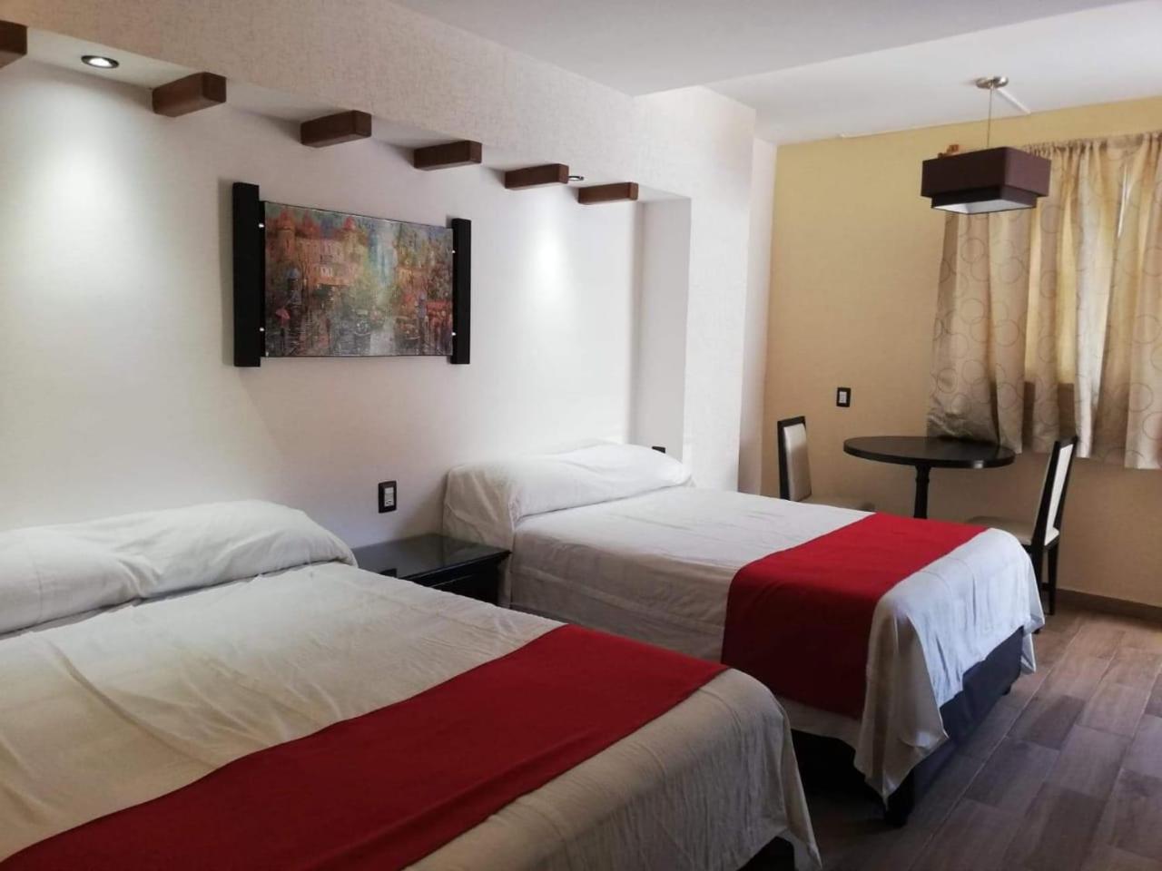 Deluxe Queen Room with Two Queen Beds photo 2