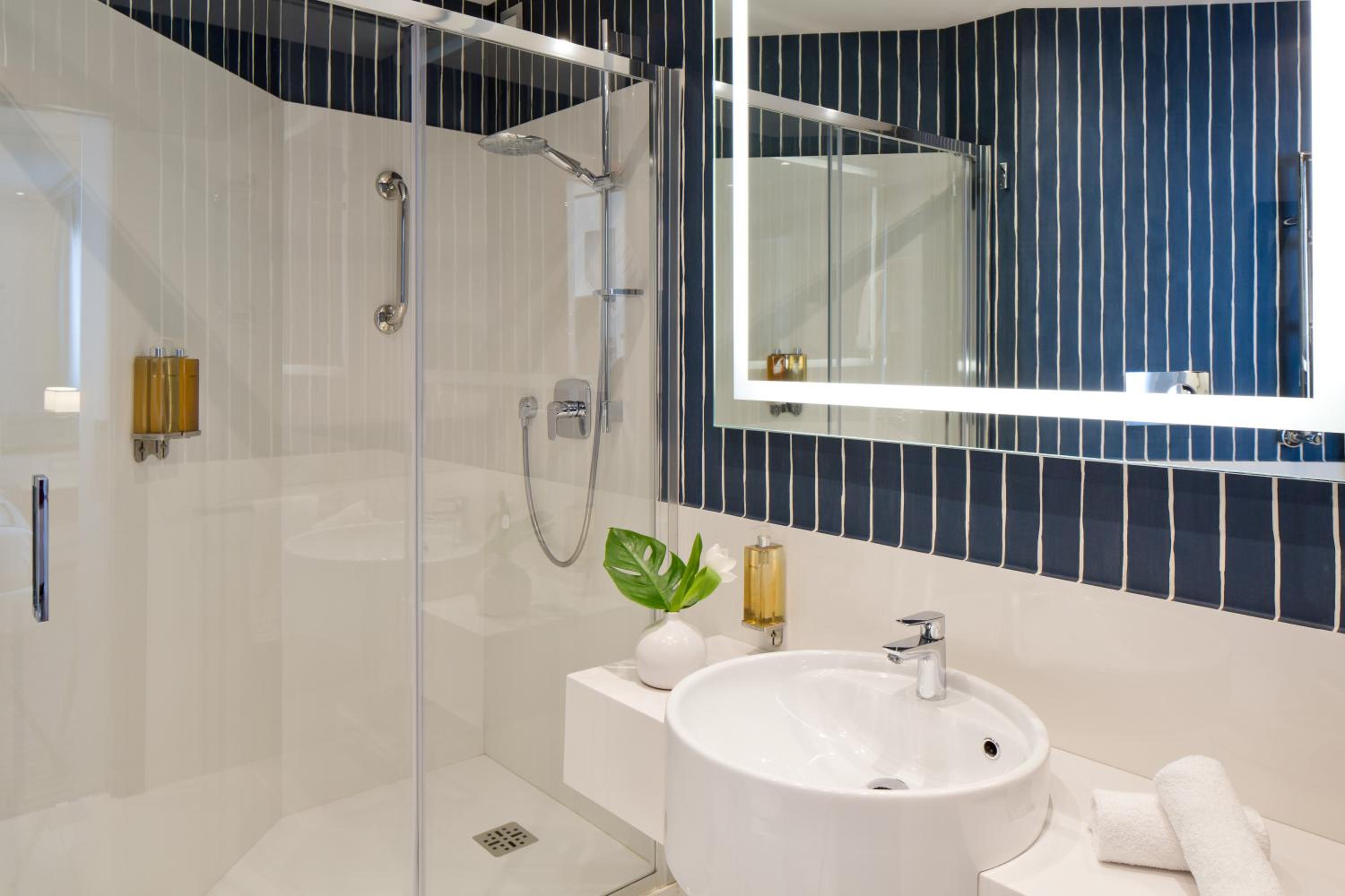 Refresh in style with our modern bathroom oasis!
