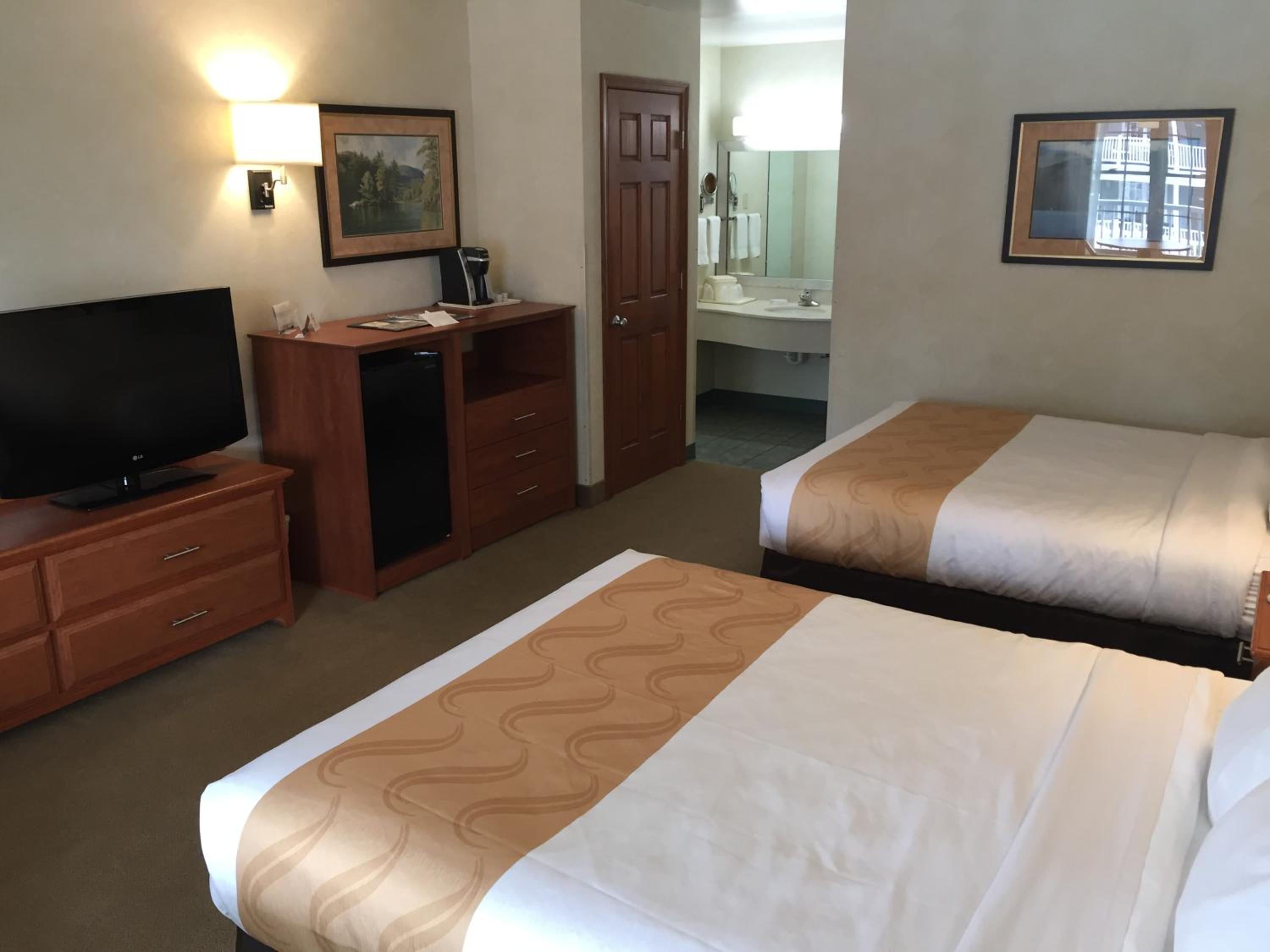 Queen Room with Two Queen Beds - Non-Smoking - Photo 1