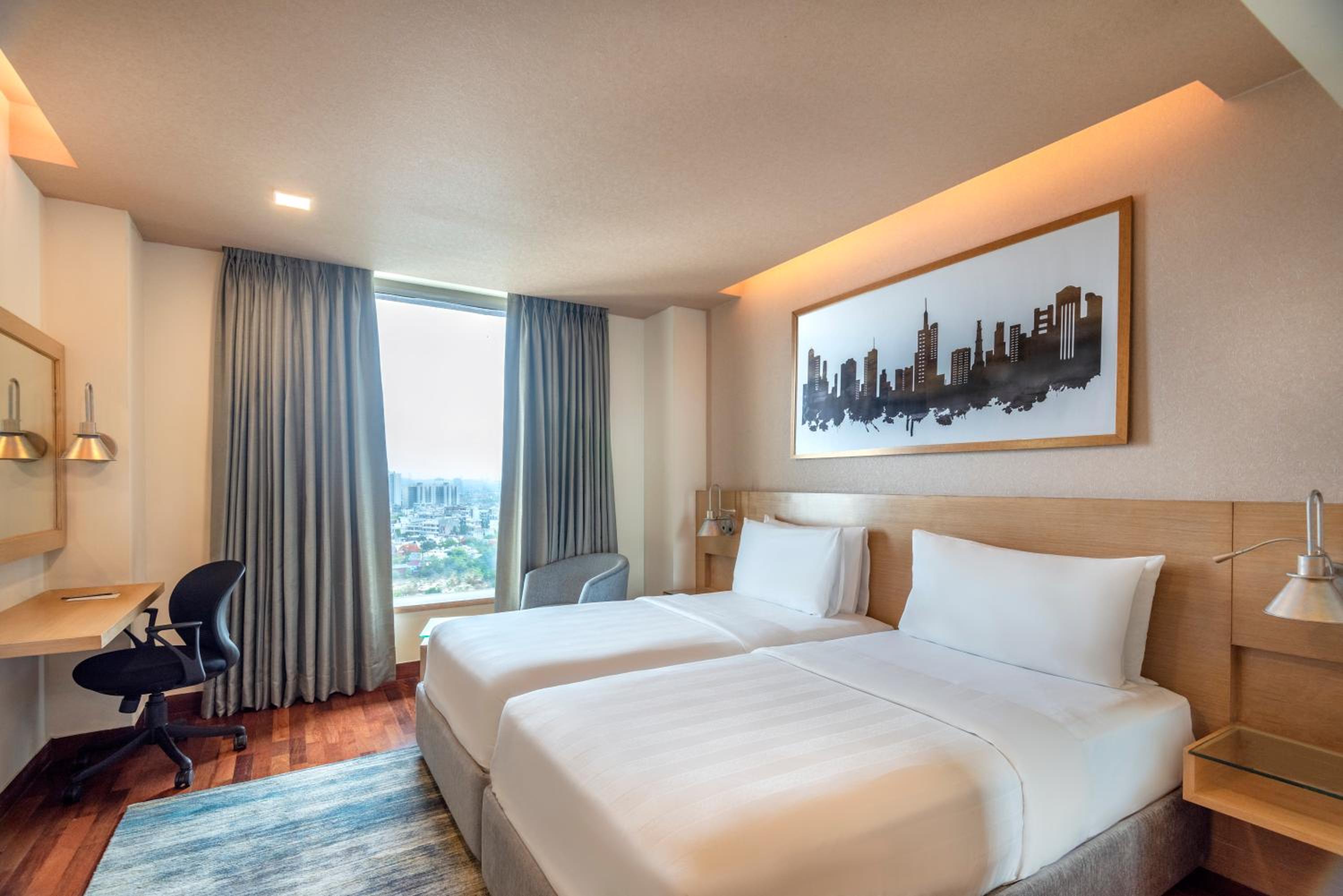 Deluxe Double or Twin Room with 20% Discount on food and soft beverages, Laundry and liquor and spa, INR 500 credit, one mug of freshly brewed beer during the stay ((330 ml)
