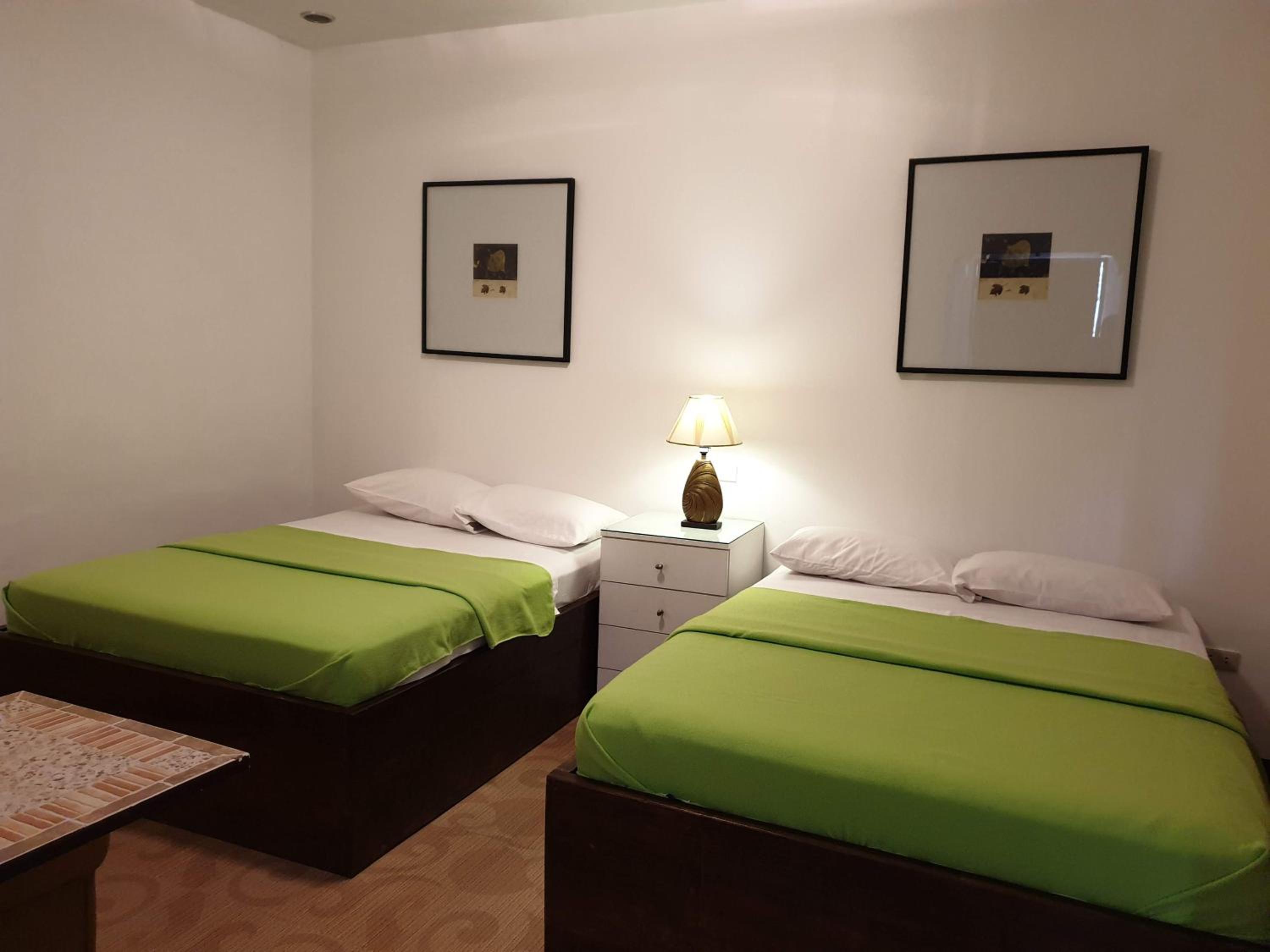Deluxe Queen Room with Two Queen Beds - Photo 1
