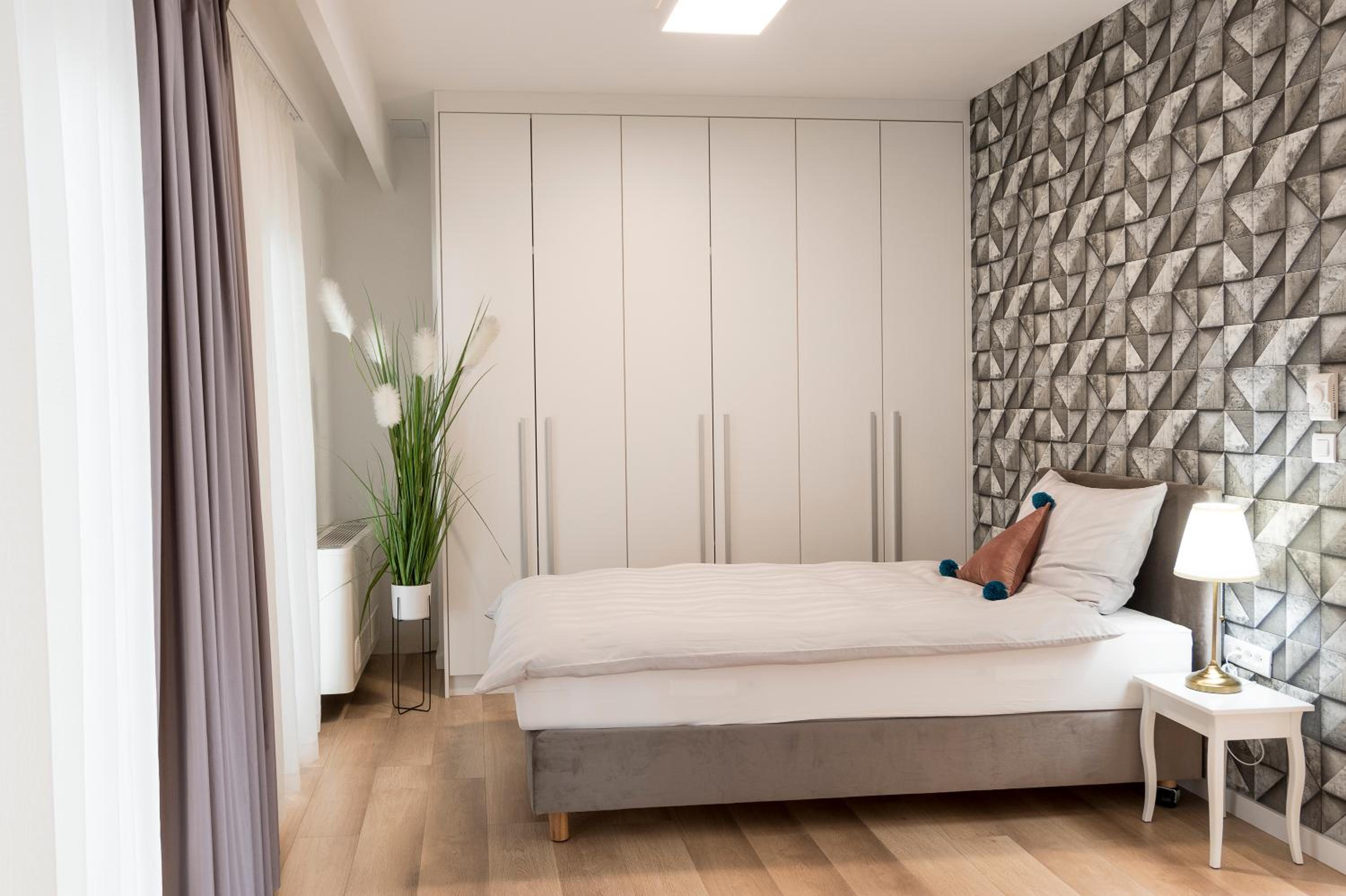 Three-Bedroom Apartment - Photo 25