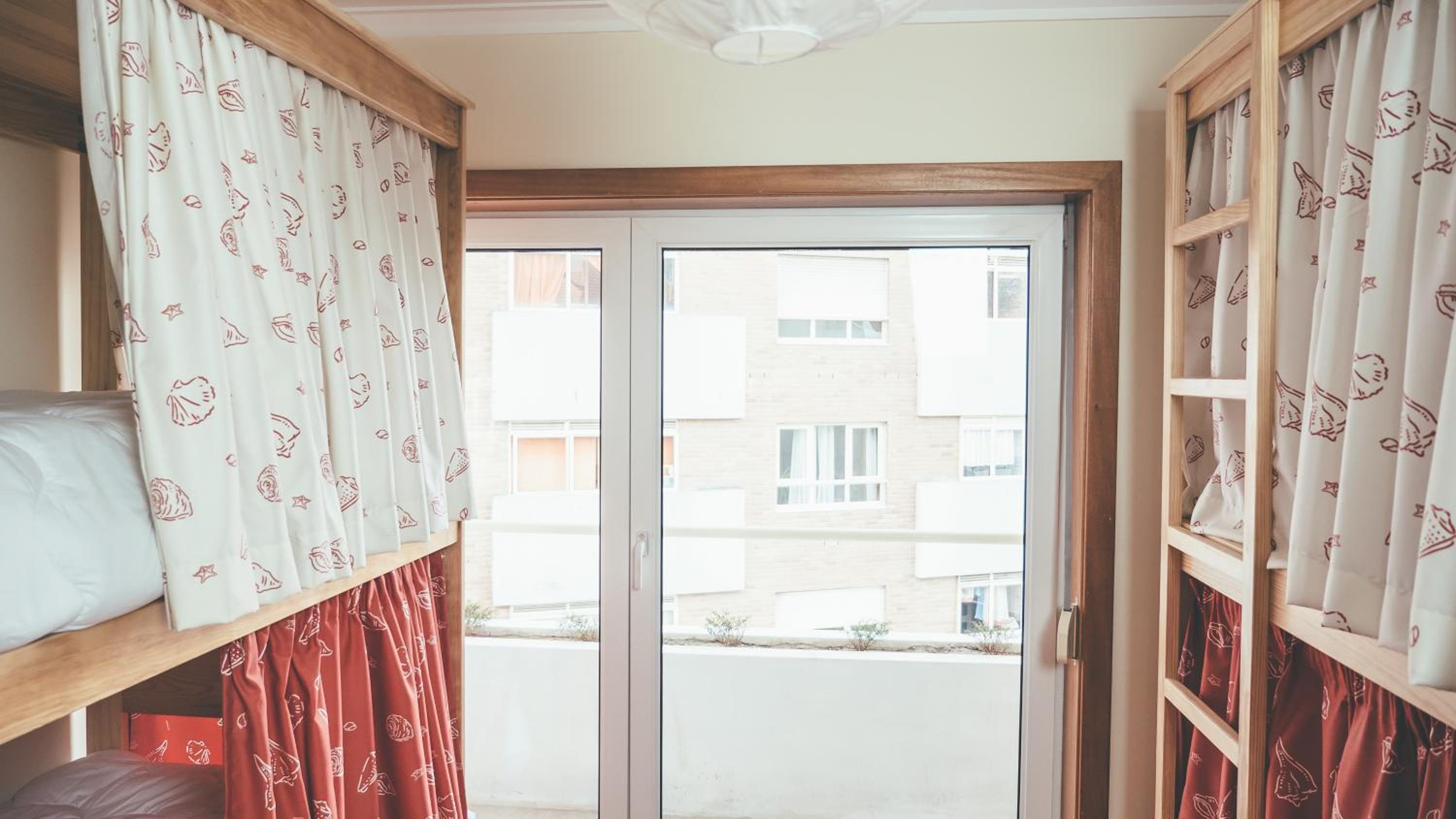 Bed in 4-Bed Mixed Dormitory Room with Balcony photo 1