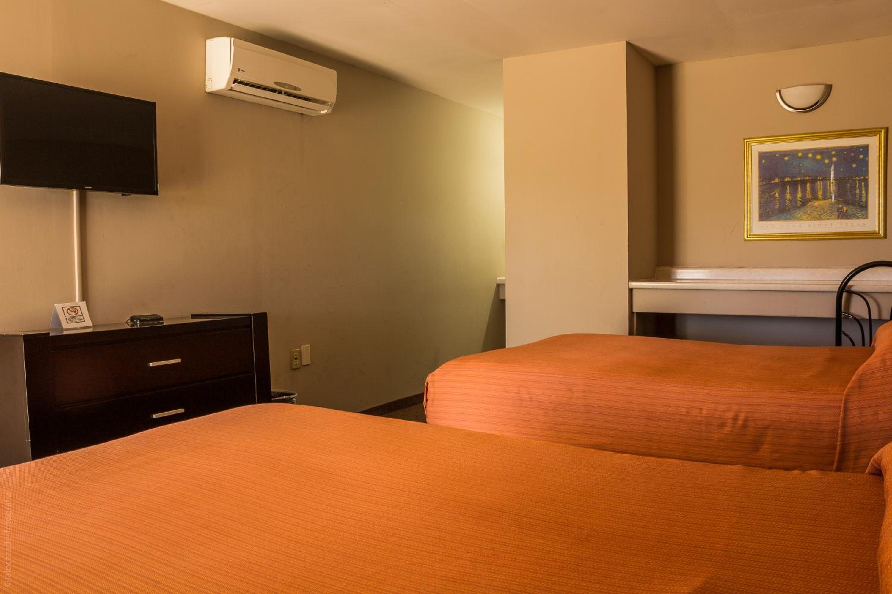 Queen Room with Two Queen Beds - Photo 1