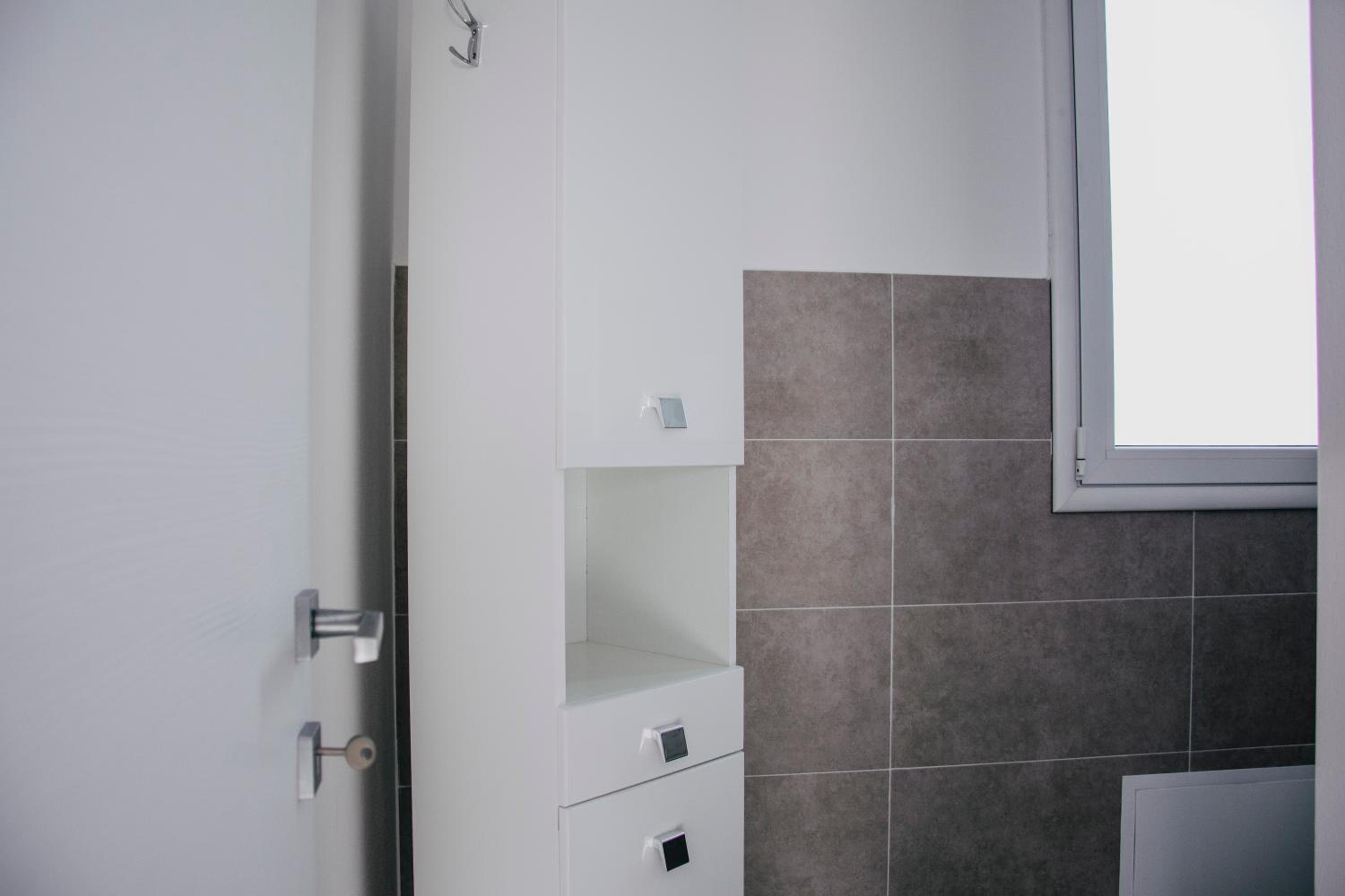 Three-Bedroom Apartment - Photo 26