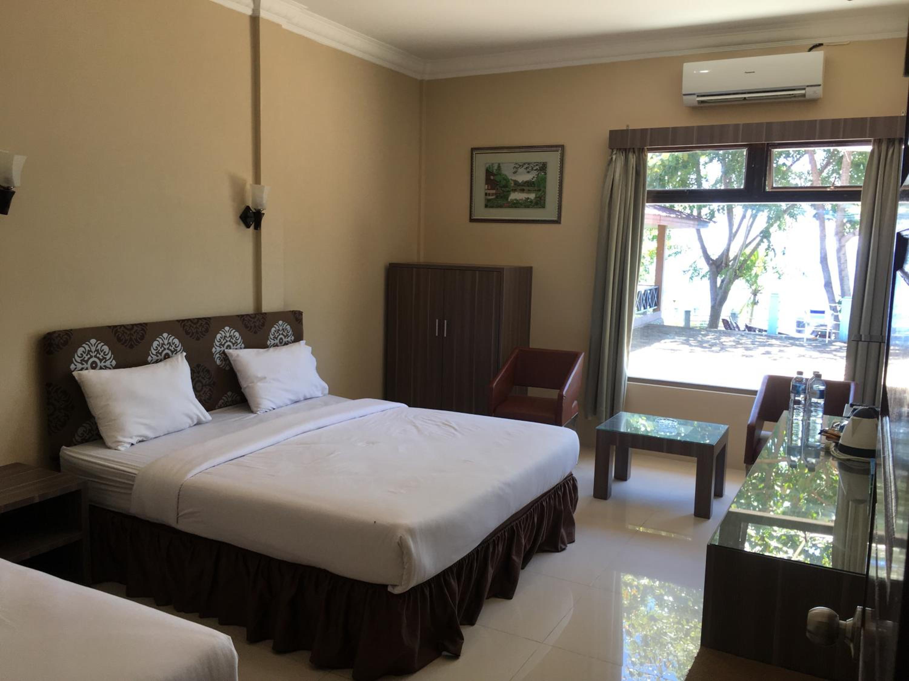  Deluxe Room (2 adults + 1 child) - Photo 1