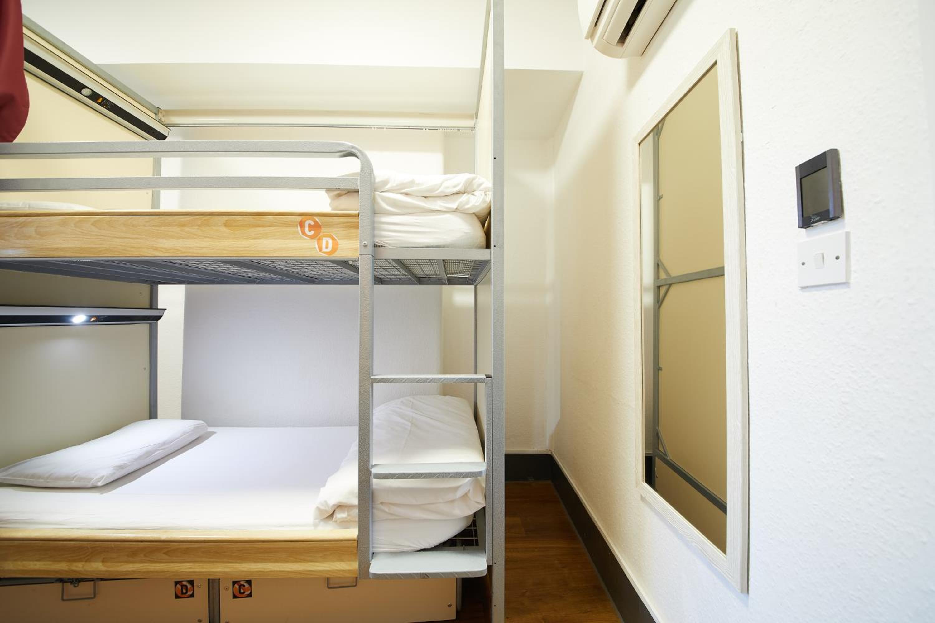 Bed in 4-Bed Mixed Dormitory Room with Private Bathroom photo 1