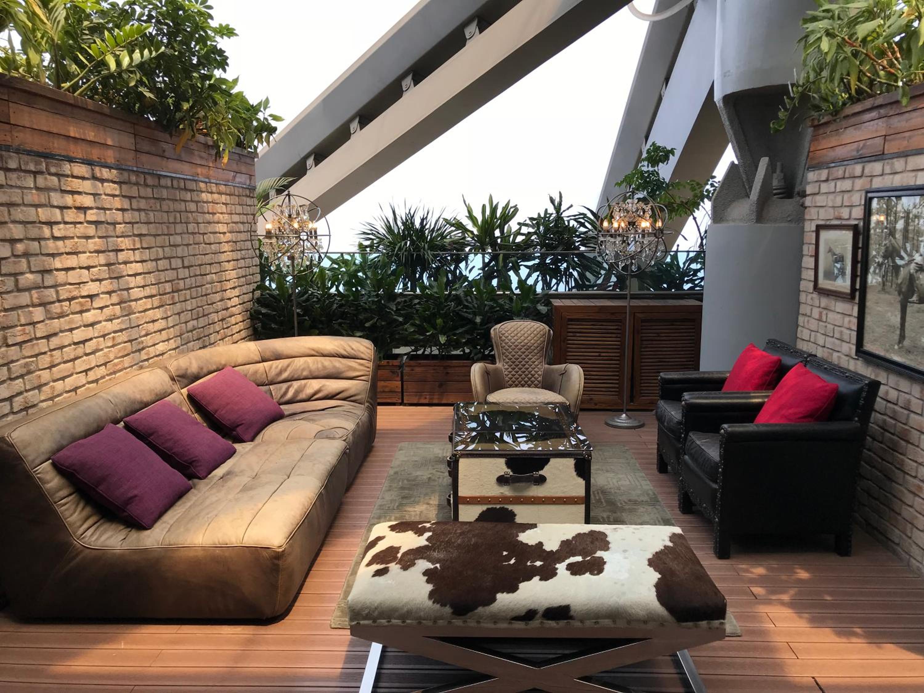 living room with couches, chairs and a coffee table