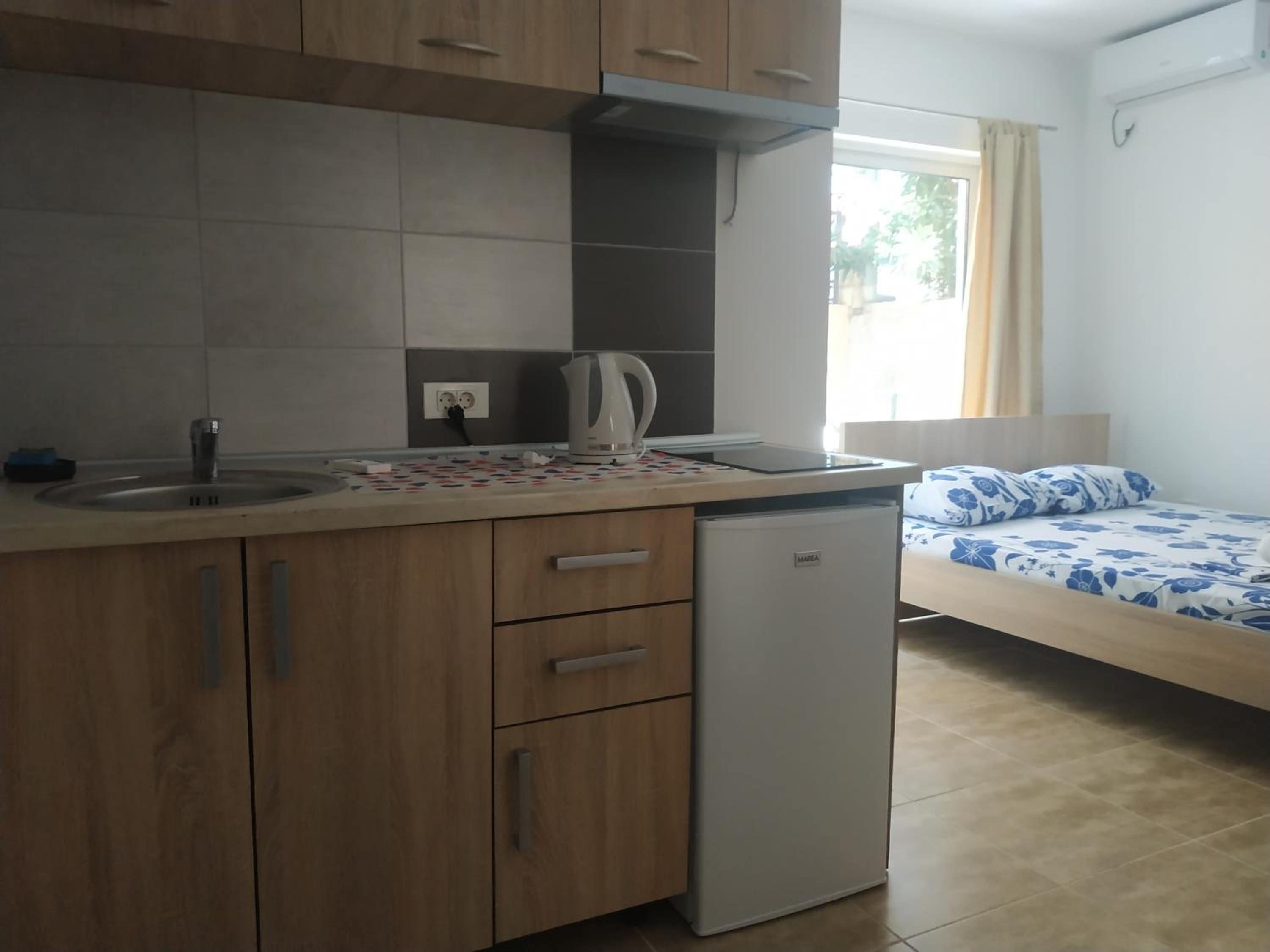 Single Bed In Male Dormitory Room With Shared Bathroom