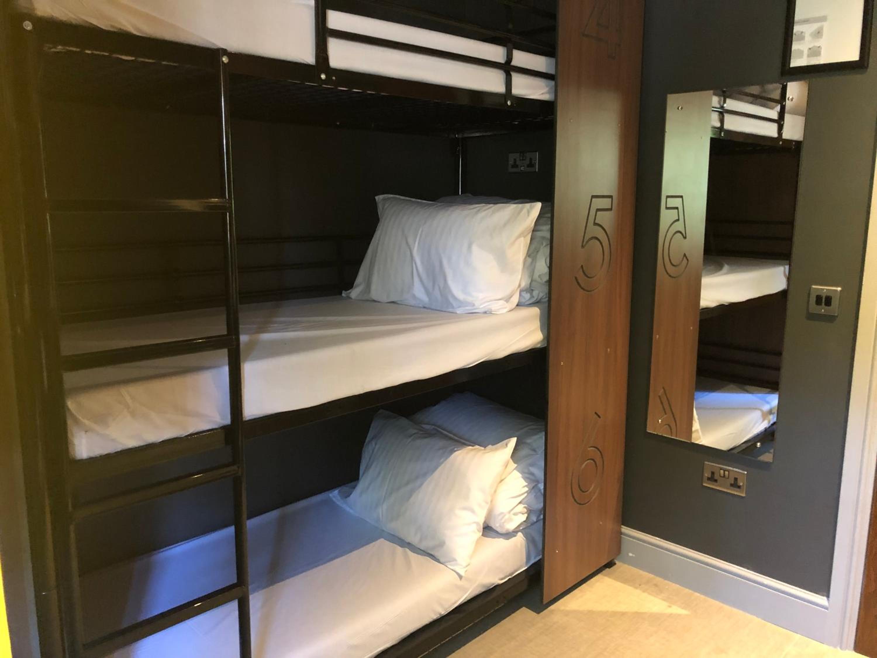Bed in 9-Bed Female Dormitory Room with Shared Bathroom photo 1
