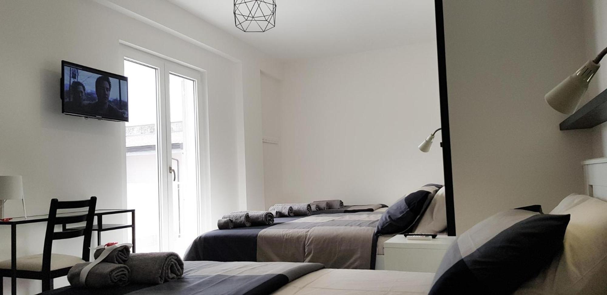 Deluxe Quadruple Room - Photo 18