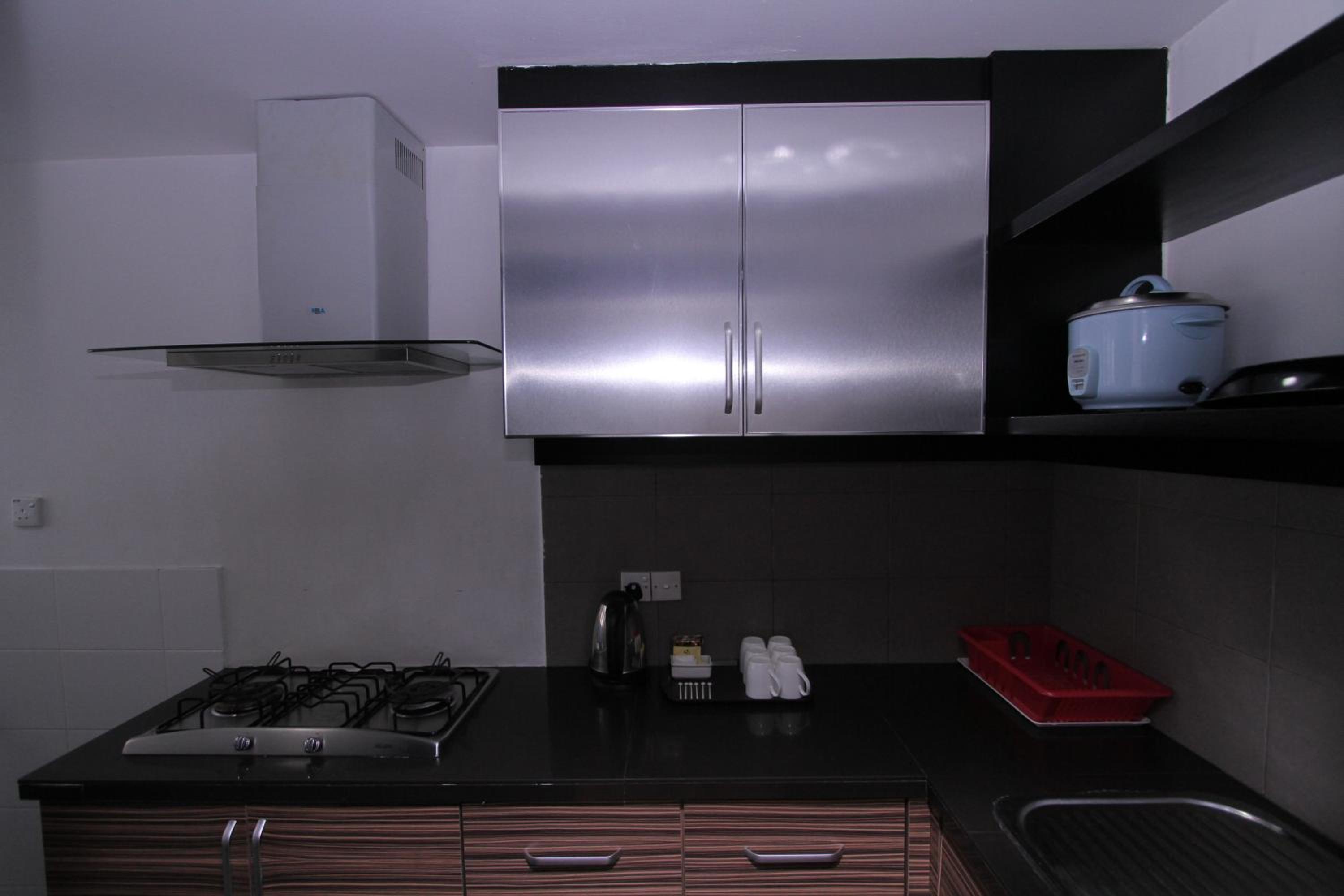 Three-Bedroom Apartment - Photo 32