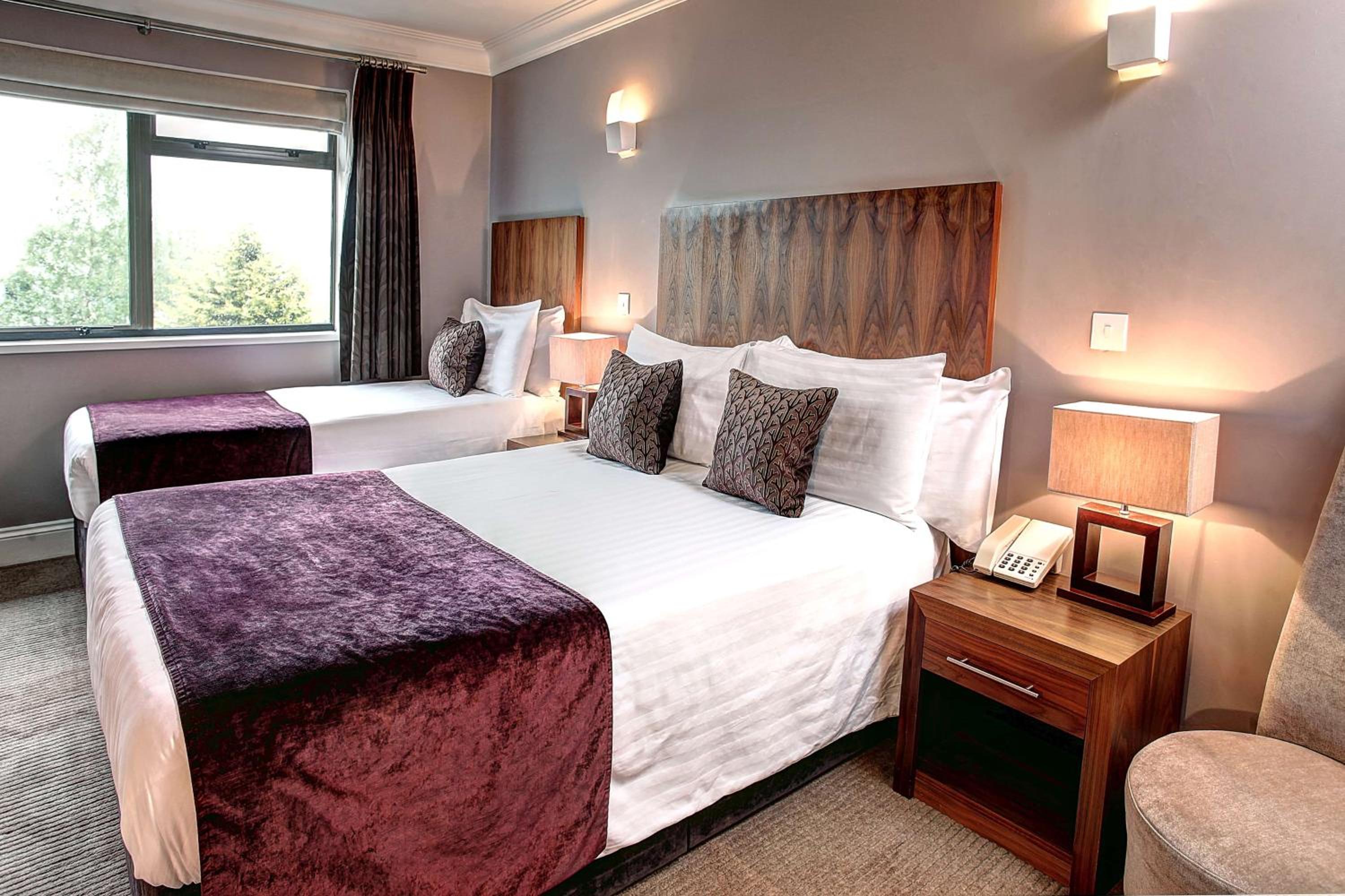 Large Room with One Double and One Single Bed - Photo 1