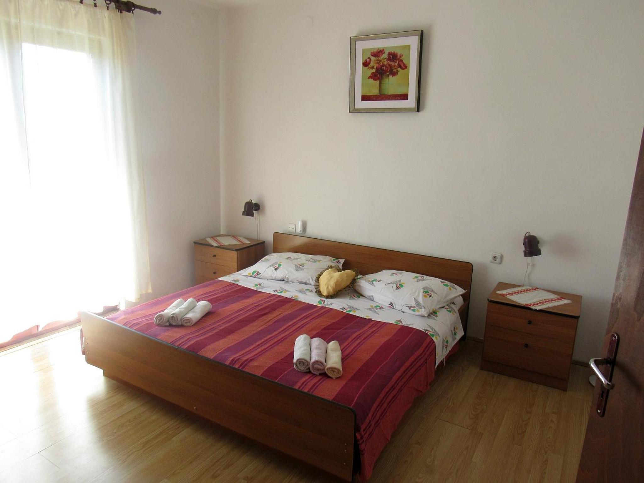 Three-Bedroom Apartment with Balcony and Garden View