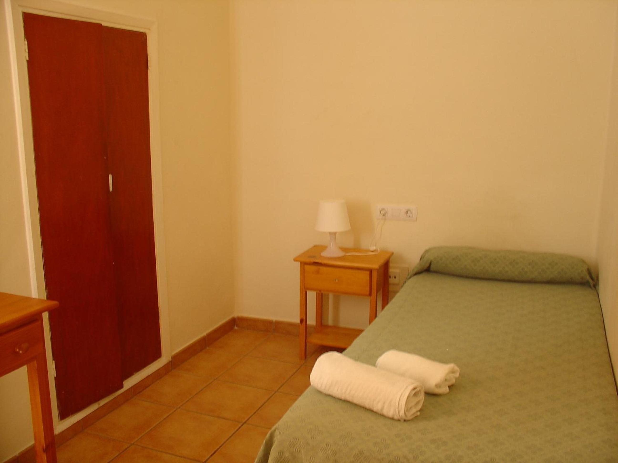 Habitación individual con baño compartido