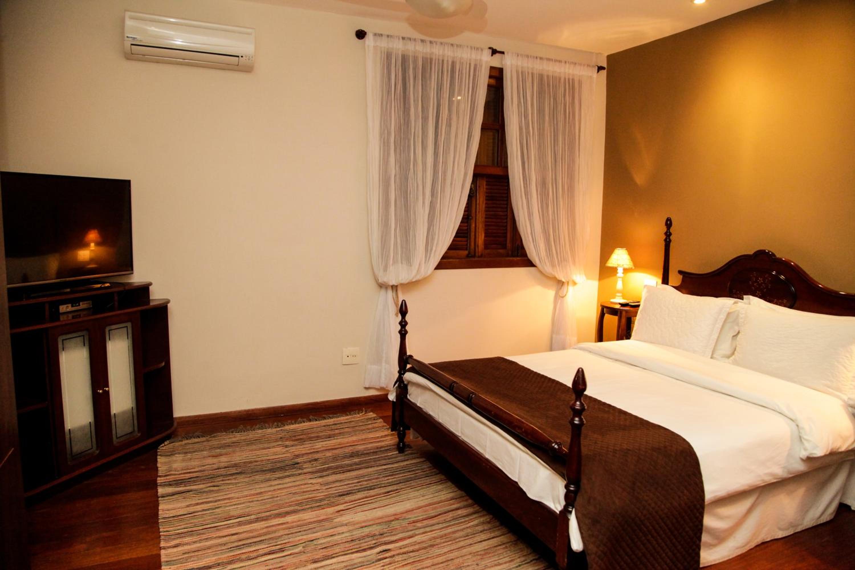 Quarto Luxo Triplo com Banheira photo 3