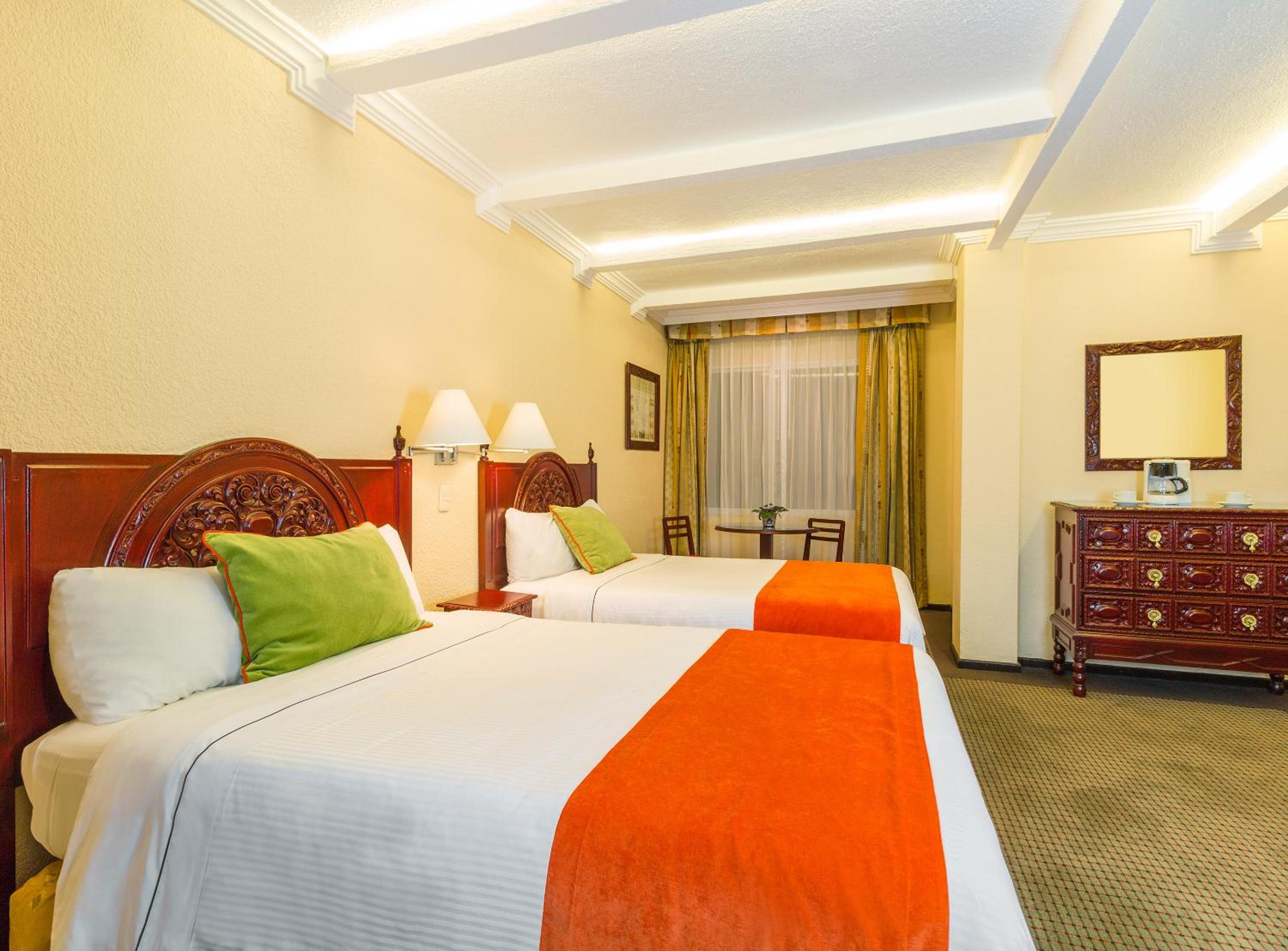 Relax in our comfy double rooms with vibrant decor!