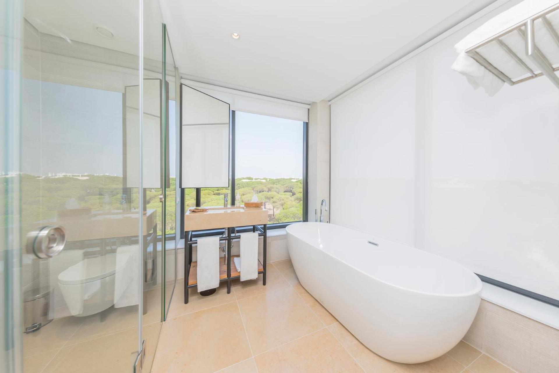 bathroom with a large bathtub in the middle of the room