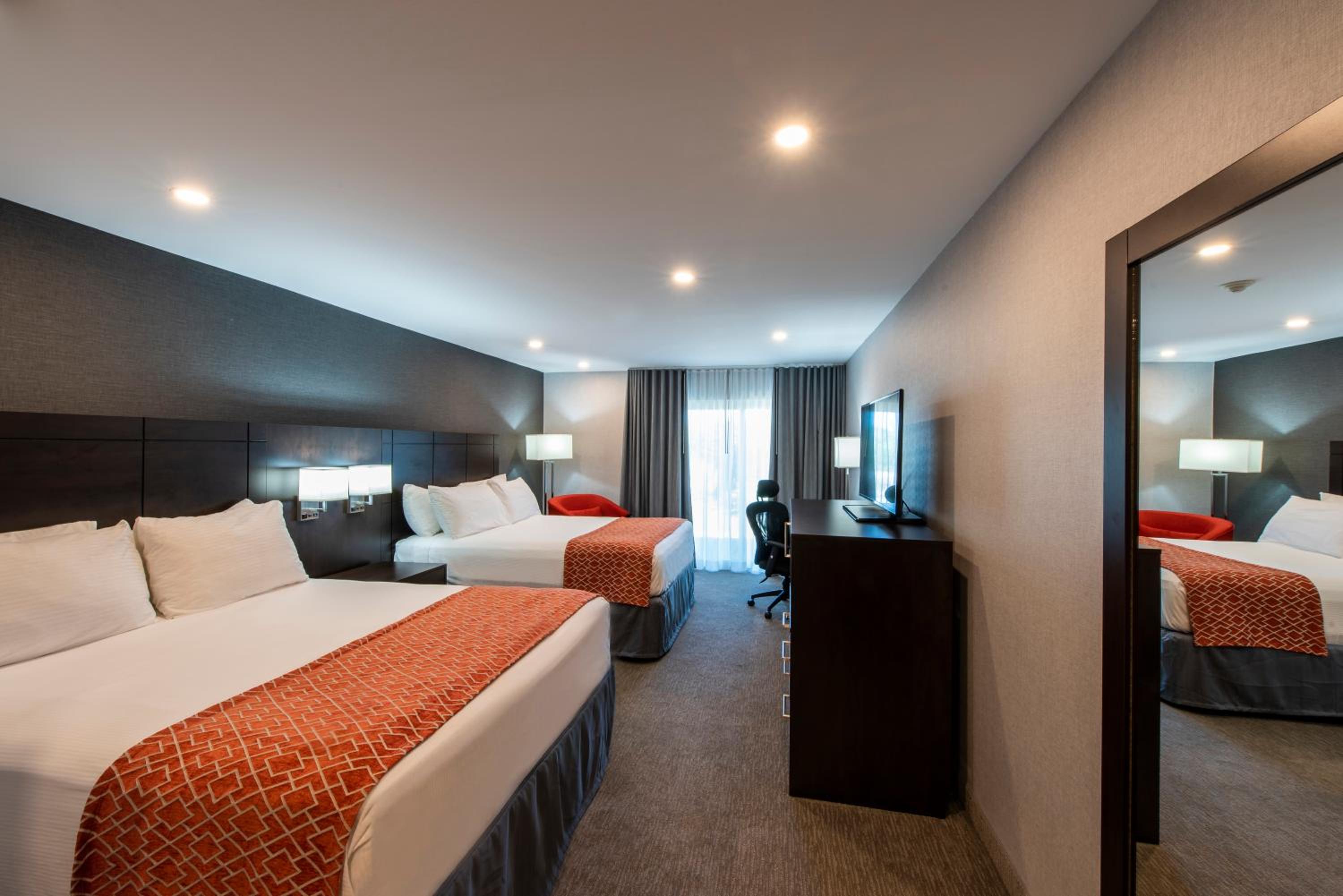 Deluxe Queen Room with Two Queen Beds - Non-Smoking photo 1