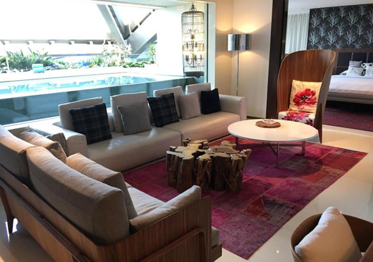 living room with a couch, coffee table, and bed