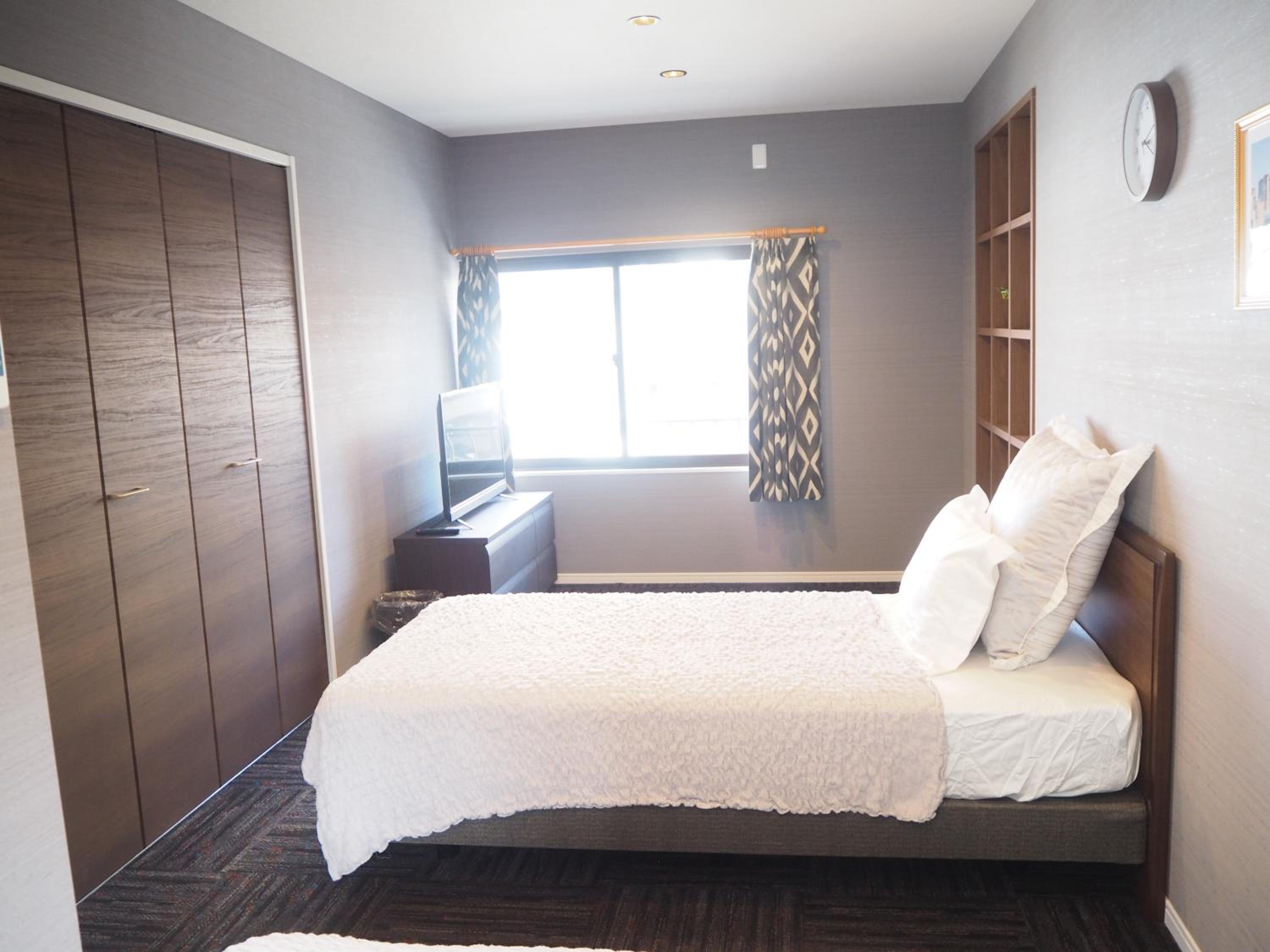 Three-Bedroom House - Photo 41