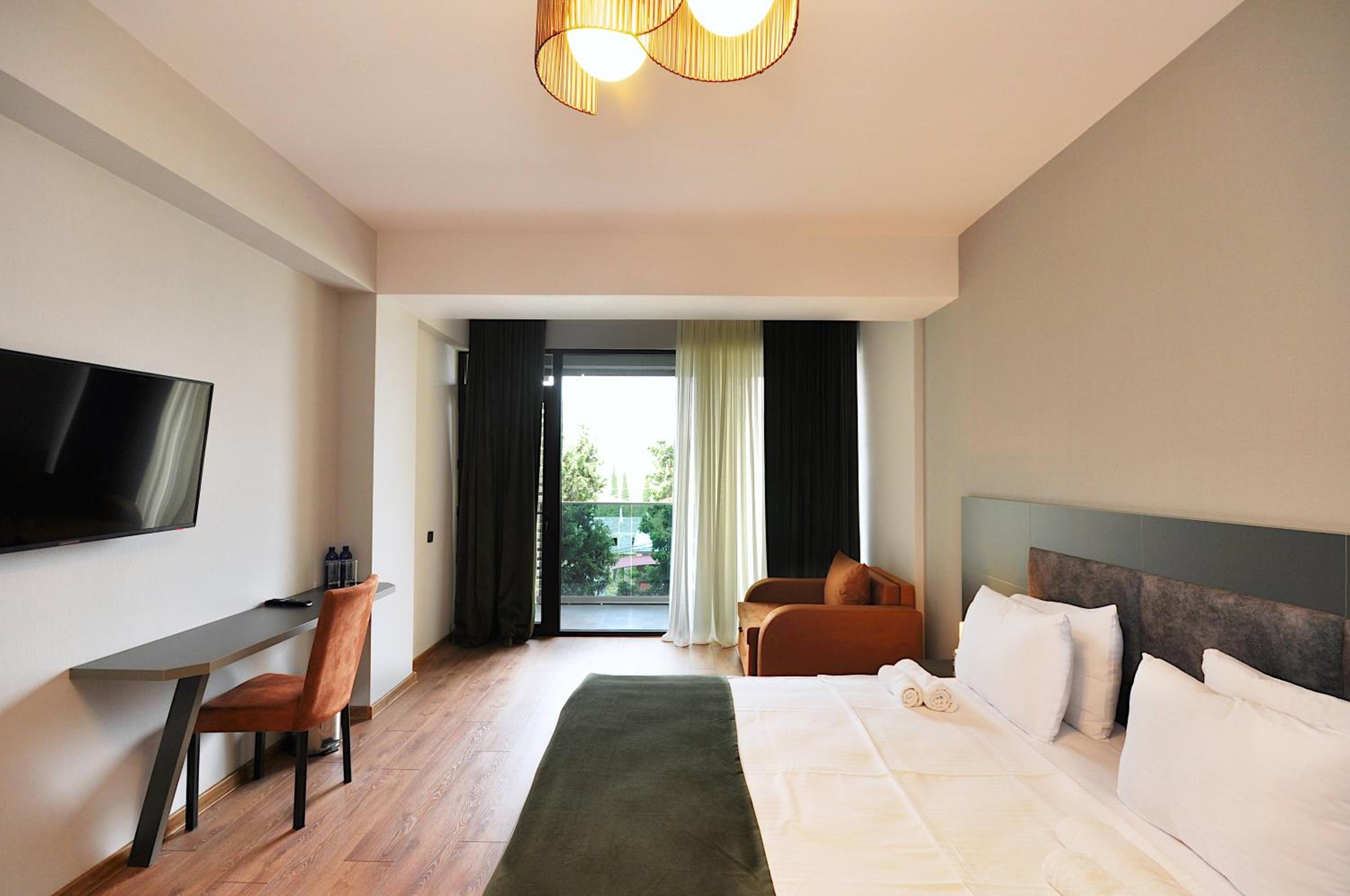 Deluxe Double Room with Balcony - Photo 1