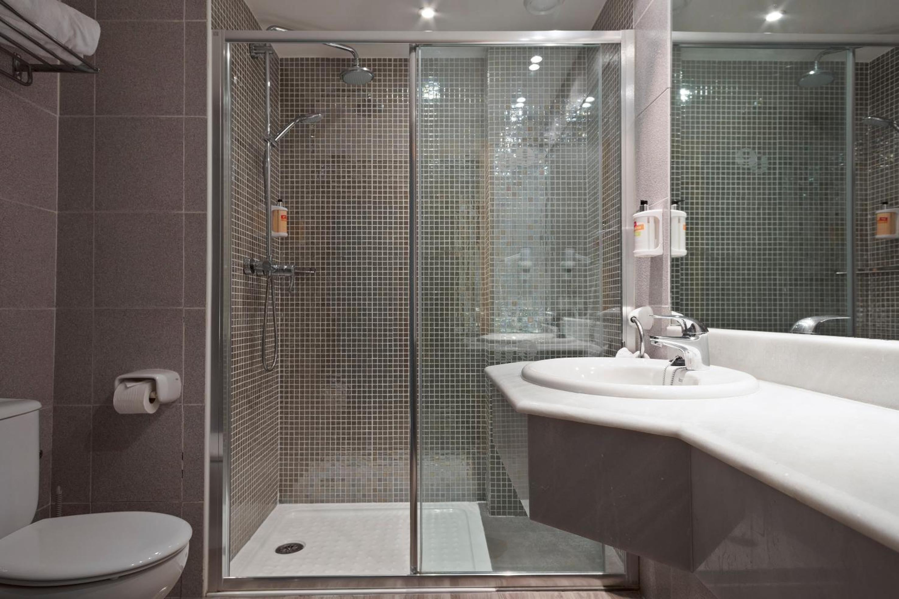 Relax in a sleek, modern bathroom sanctuary.